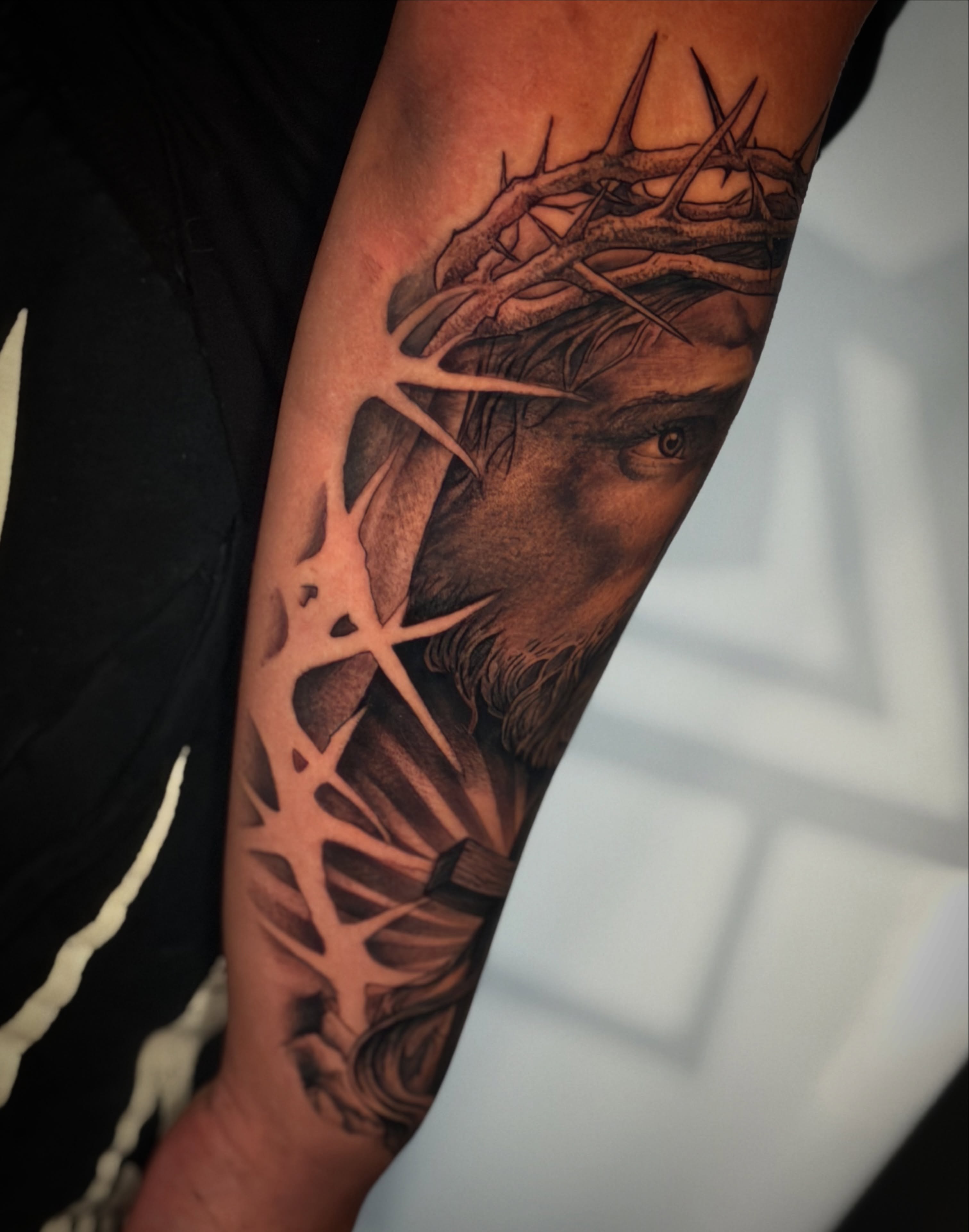 Religious figure realism tattoo on the forearm by Las Vegas Tattoo Artist