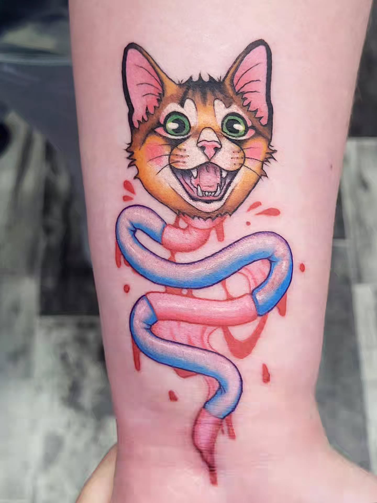 Cat with snake new school tattoo on the forearm by TEA ☕️ Tattoos