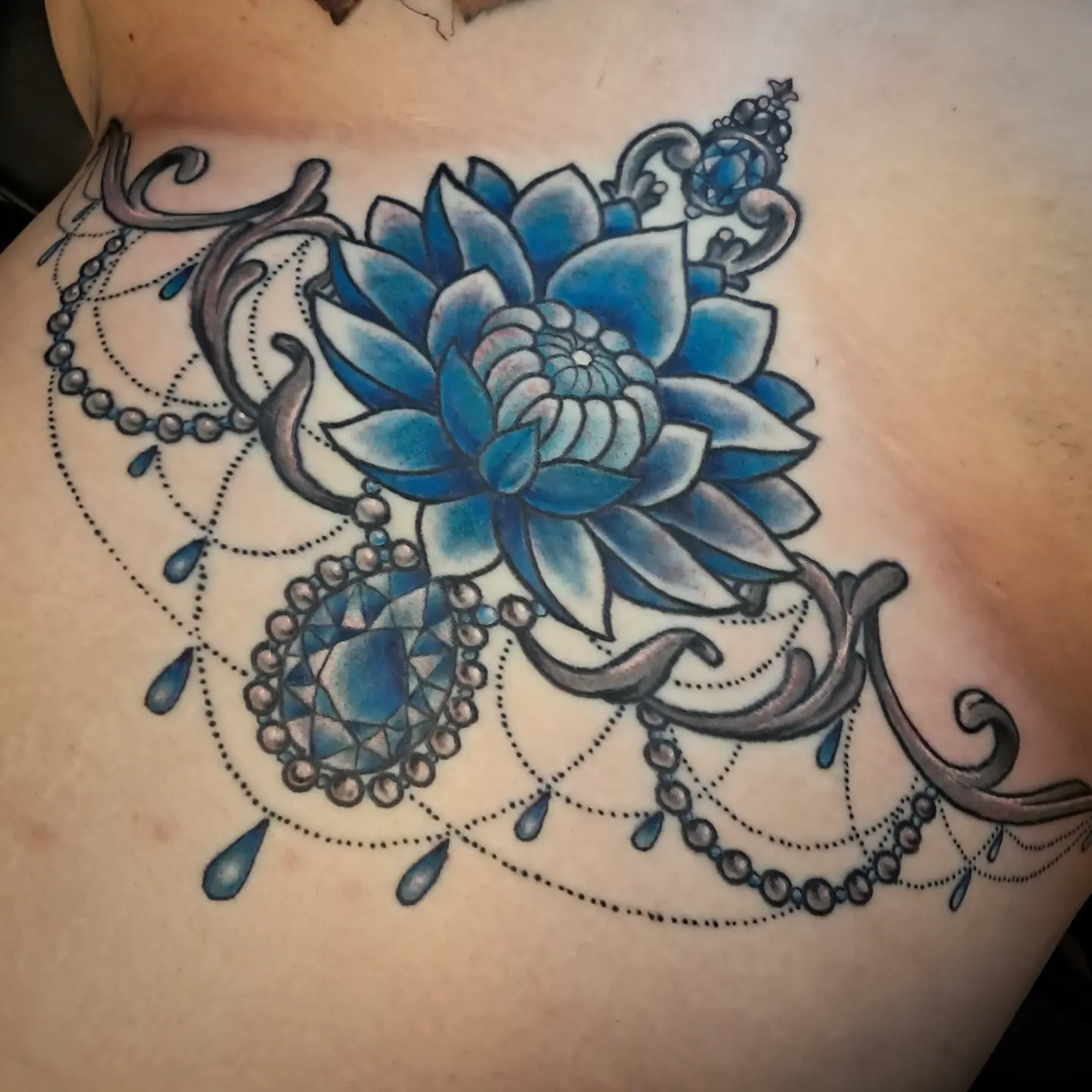 Lotus flower geometric tattoo by Erika Hollingsworth