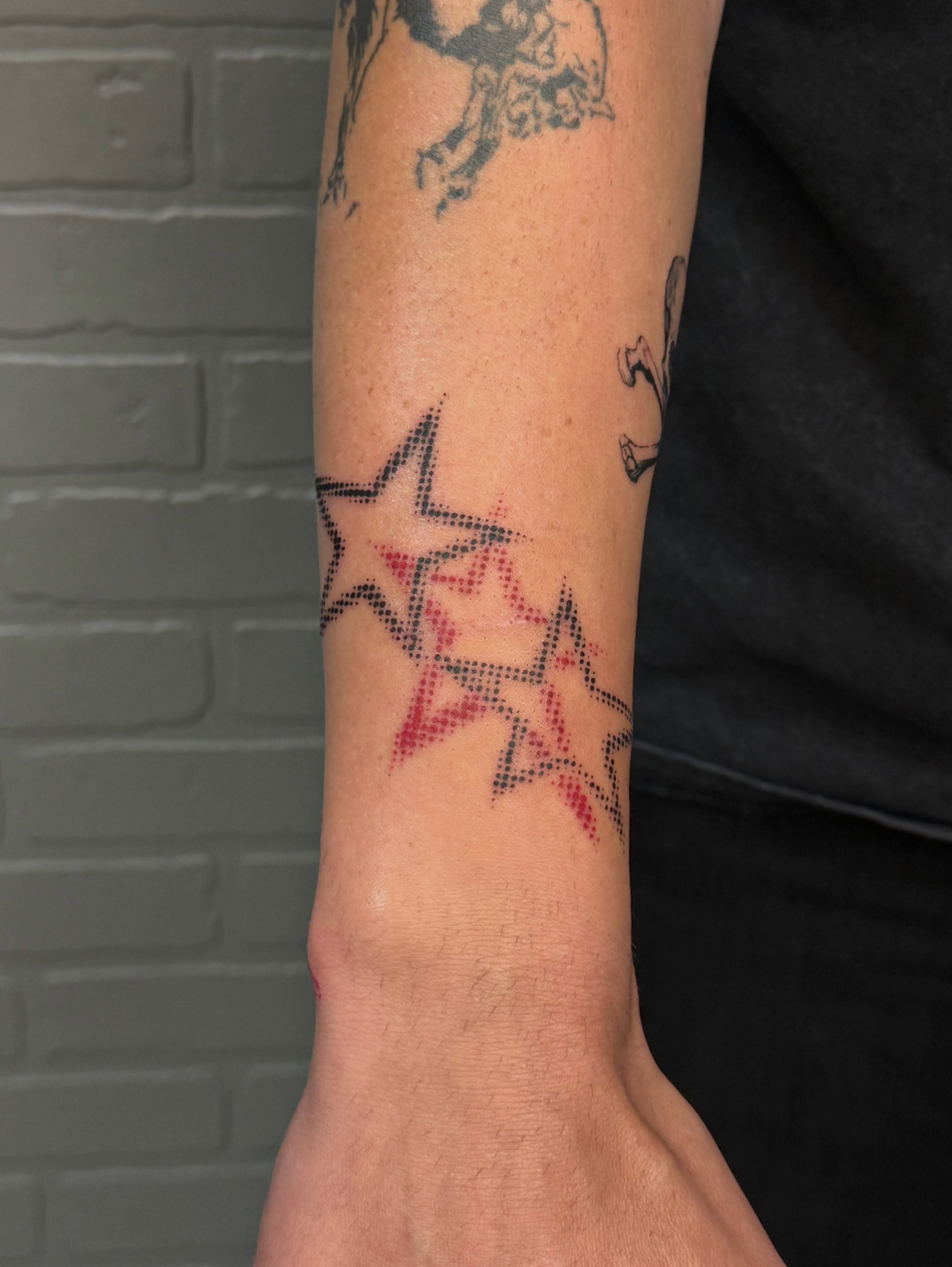 Stars dotwork tattoo on the forearm by Nevaeh tattoo artist