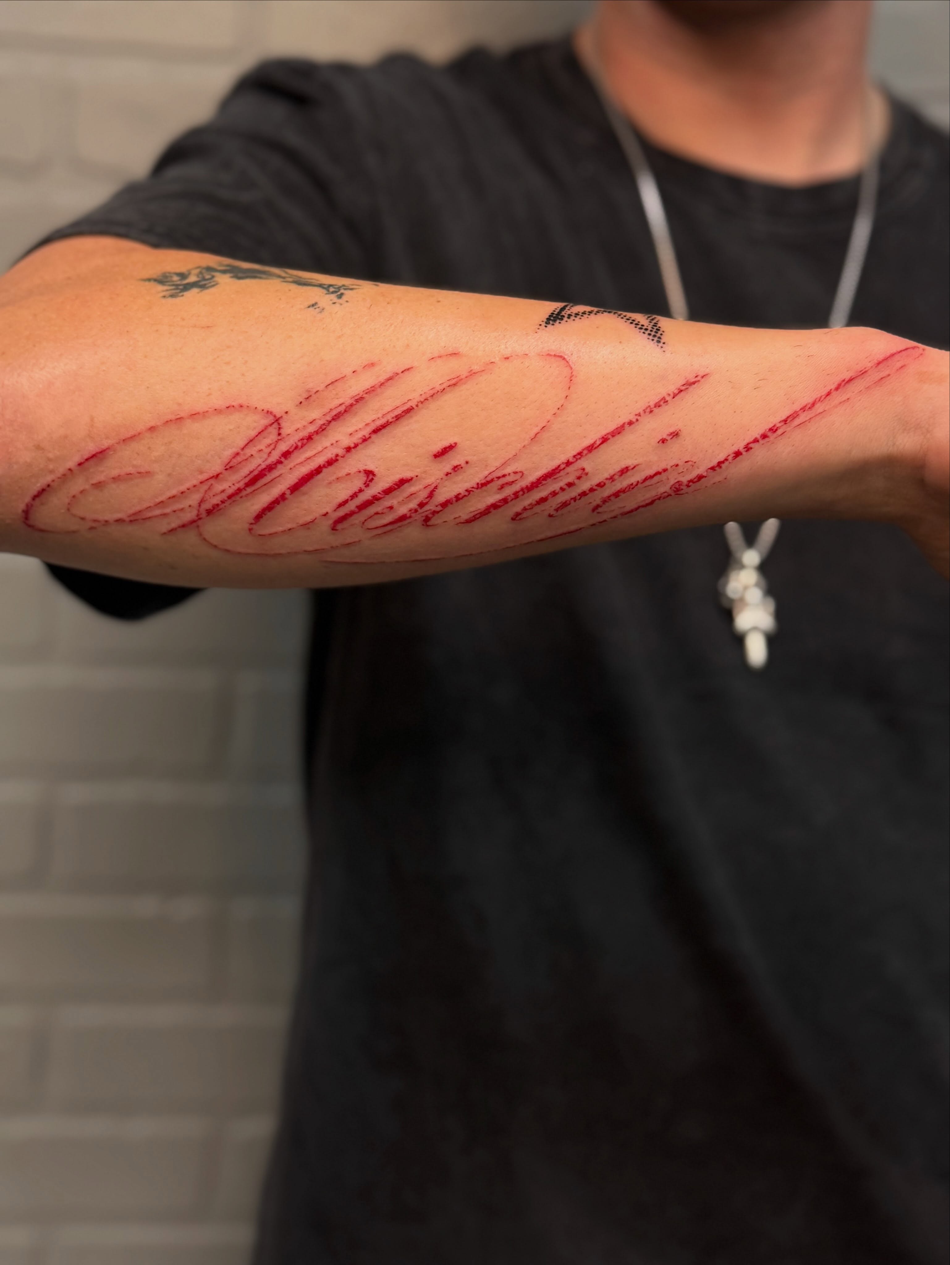 Script lettering lettering script tattoo on the forearm by Nevaeh tattoo artist
