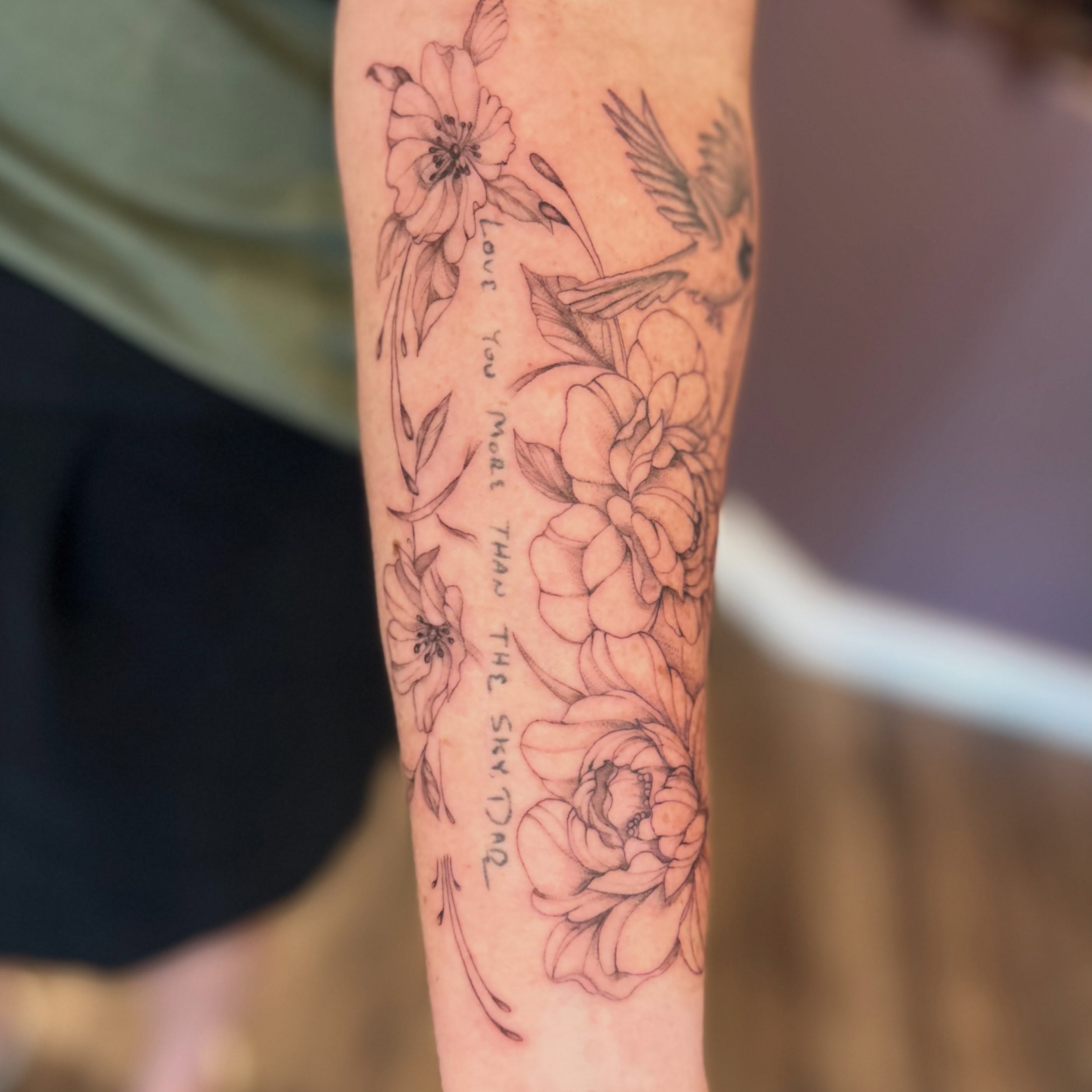 Flowers and script black and grey tattoo on the forearm by Elizabeth (Lib), Murfreesboro, Tennessee