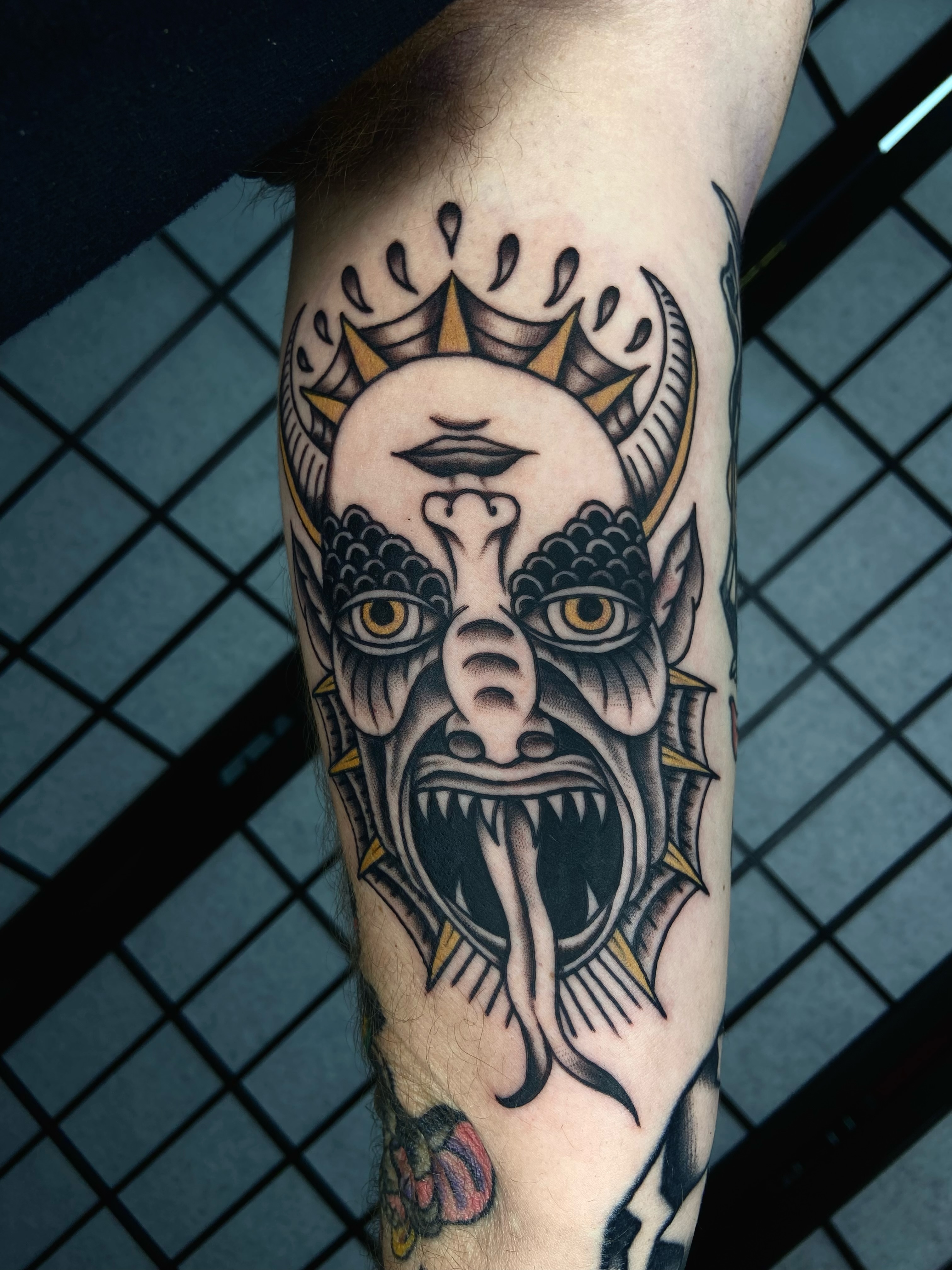Demon face American traditional tattoo on the forearm by R y a n S m i t h