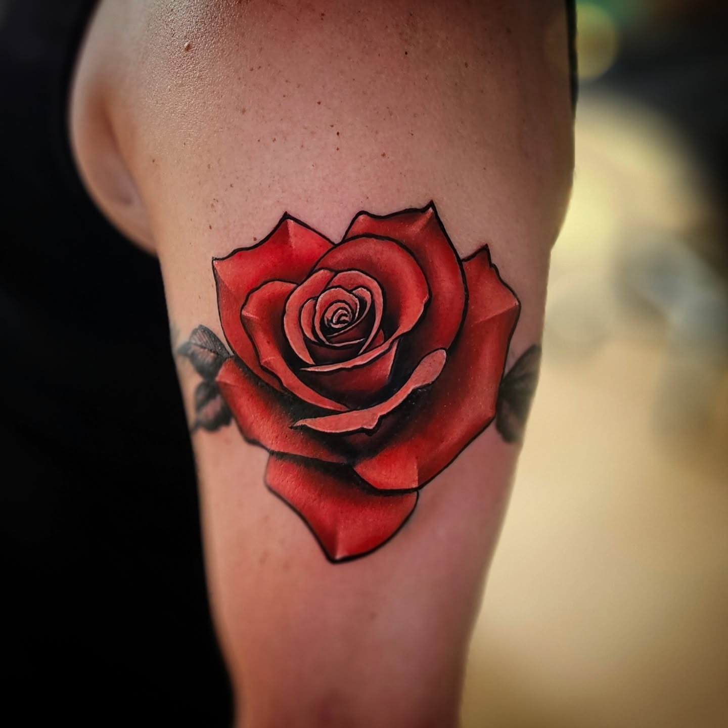 Red rose realism tattoo on the forearm by Justin J-rust Smith