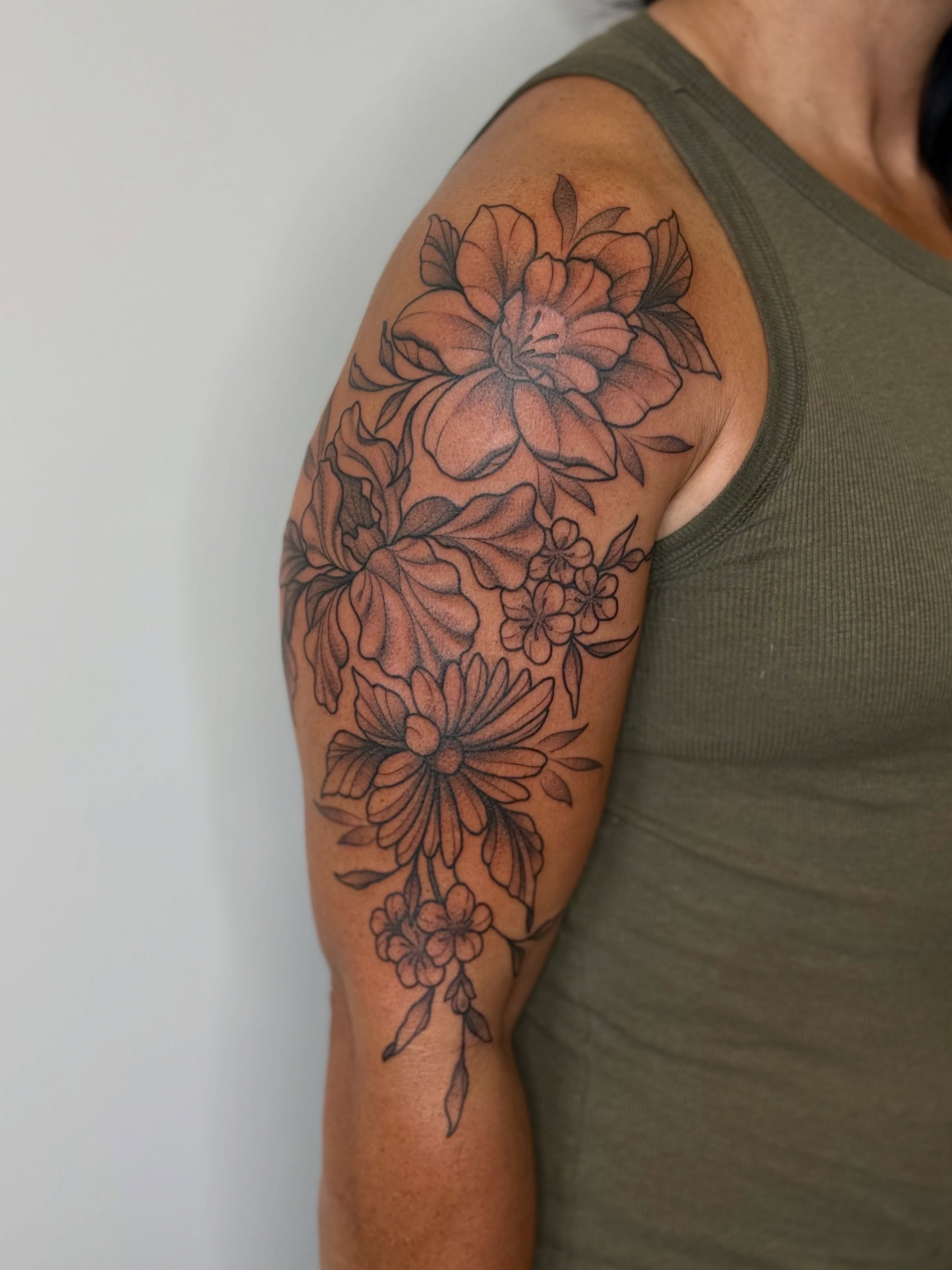 Floral bouquet black and grey tattoo on the upper arm by Emma Friesen - Lancaster & York Tattoo Artist, Lancaster, Pennsylvania