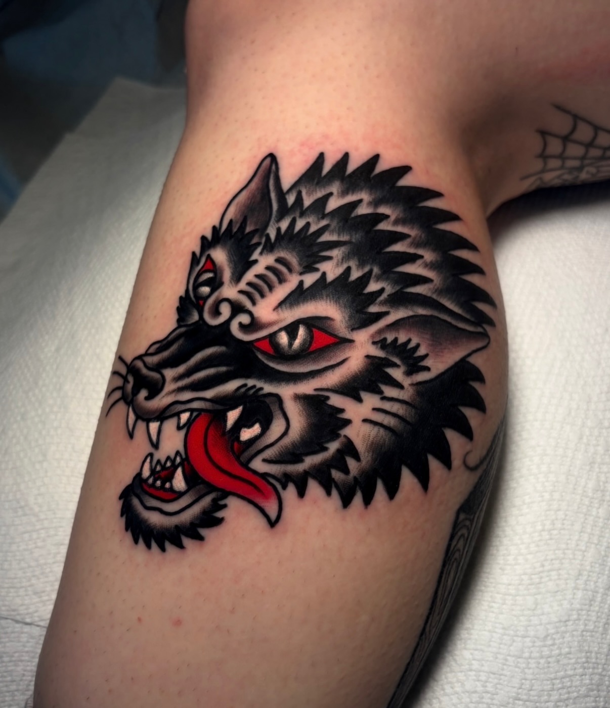 Wolf American traditional tattoo on the forearm by Mickey Putillo, Charlotte, North Carolina