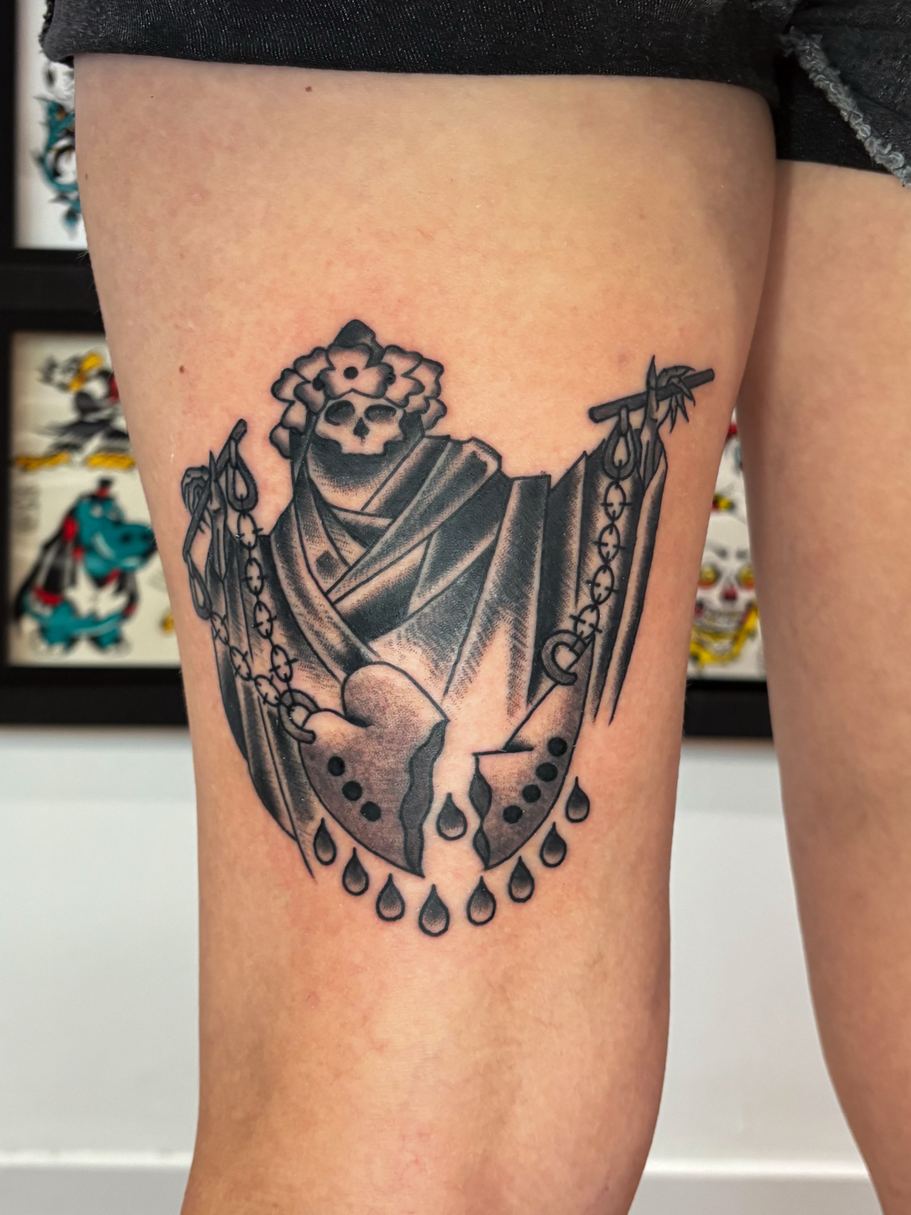 Skeleton with floral crown black and grey tattoo on the thigh by Evan Bisso, Philadelphia, Pennsylvania