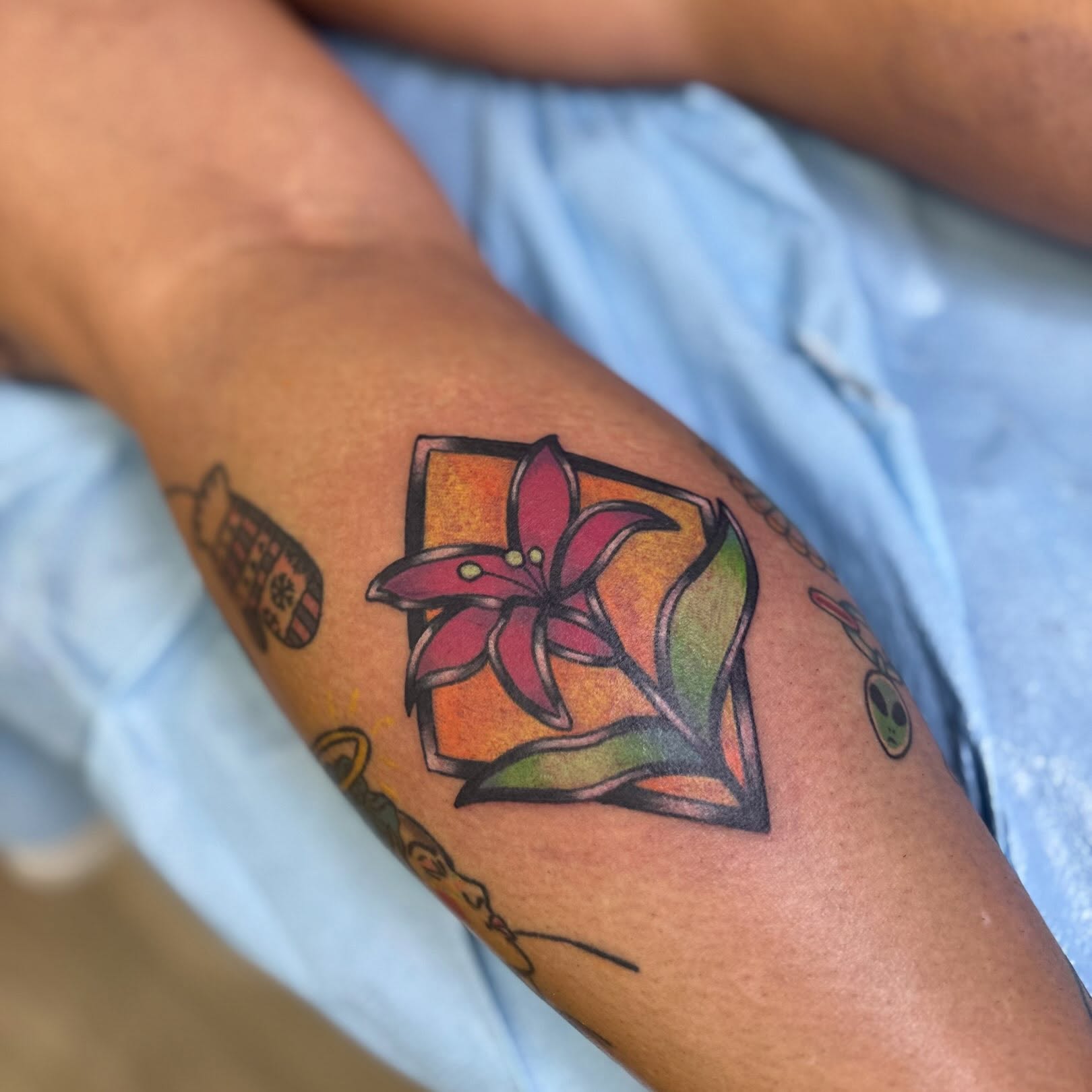 Lily new school tattoo on the forearm by Taylor  Thompson