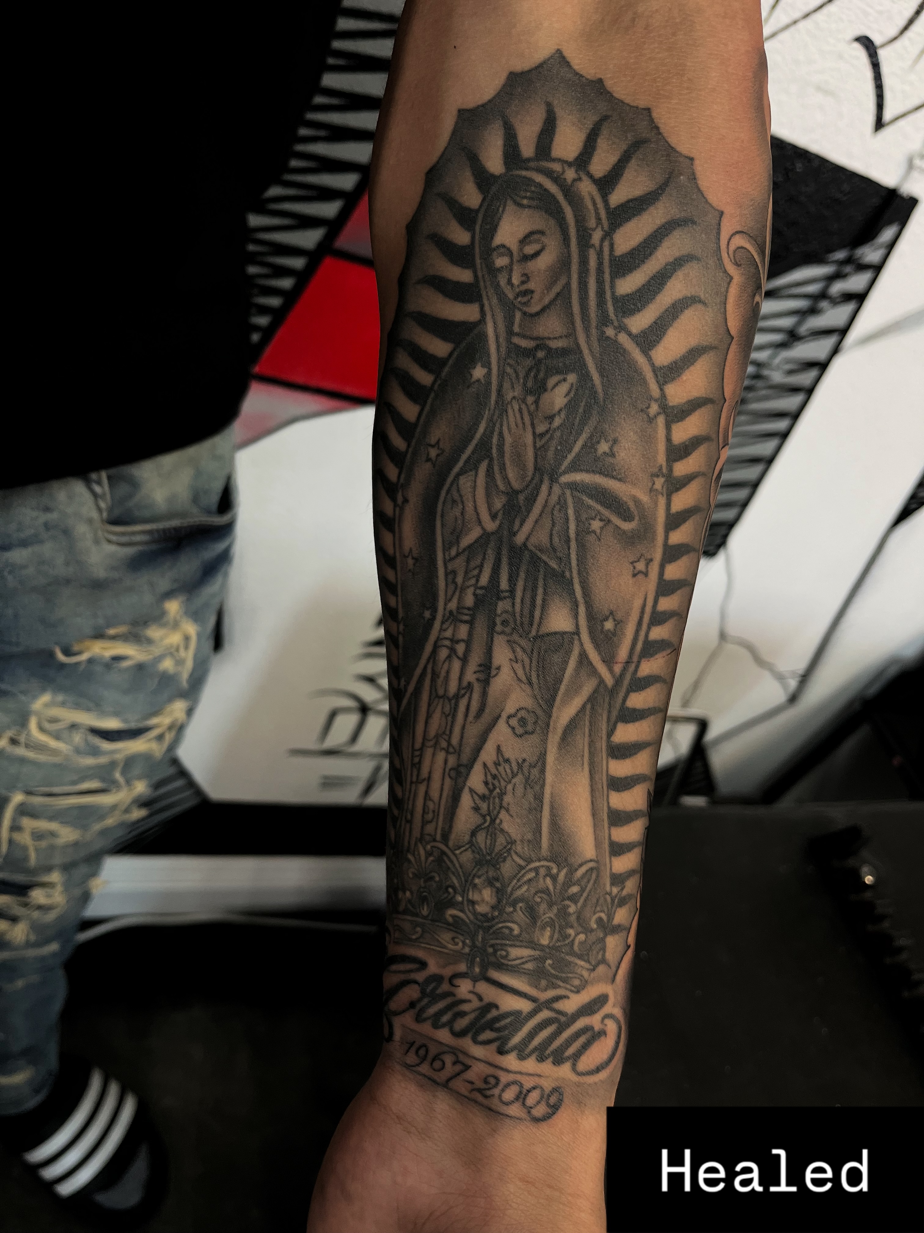 Our Lady of Guadalupe black and grey tattoo on the forearm by Kwete Tatuajes
