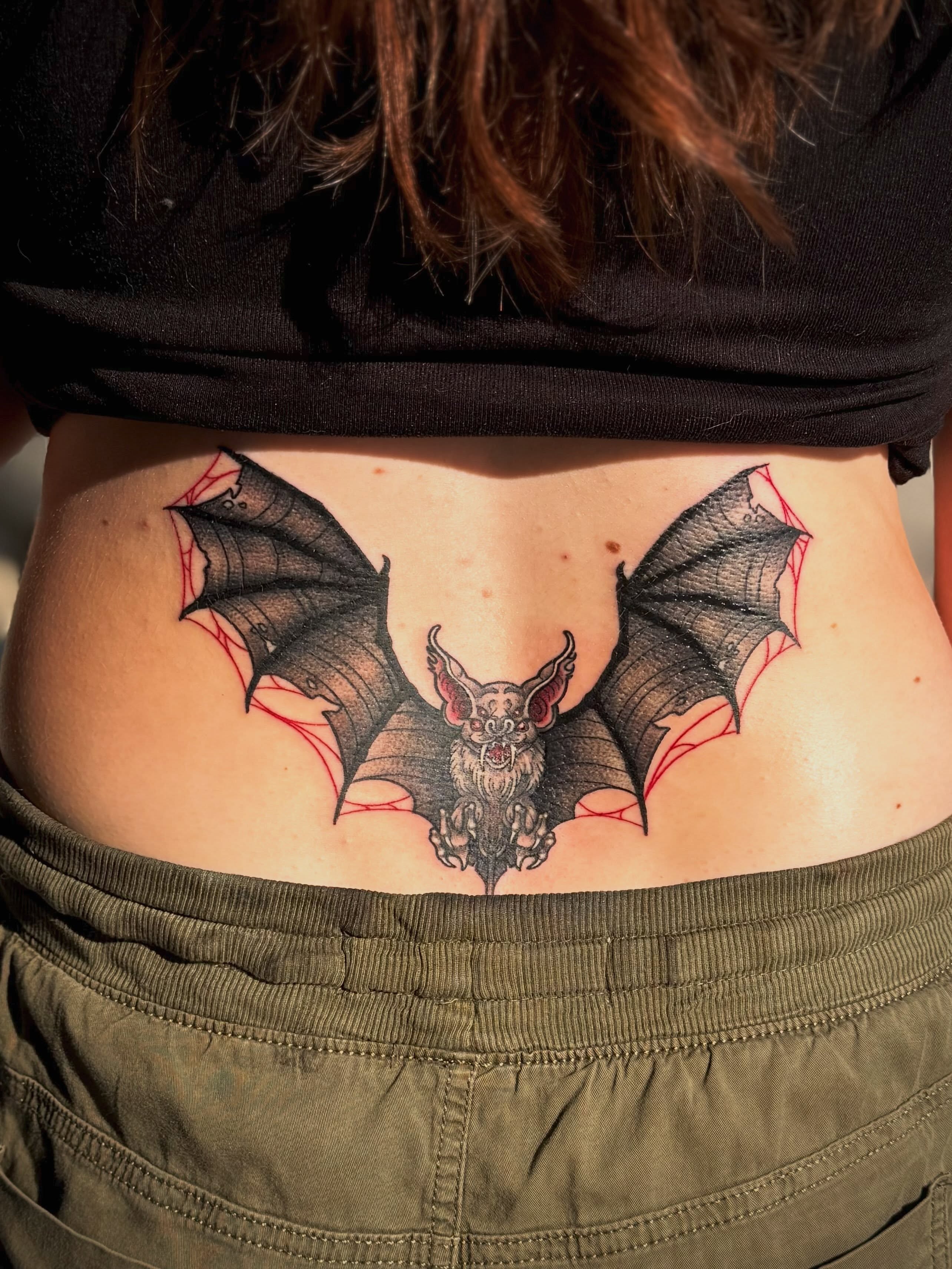 Bat dark realism tattoo on the torso by Ashley Kayser