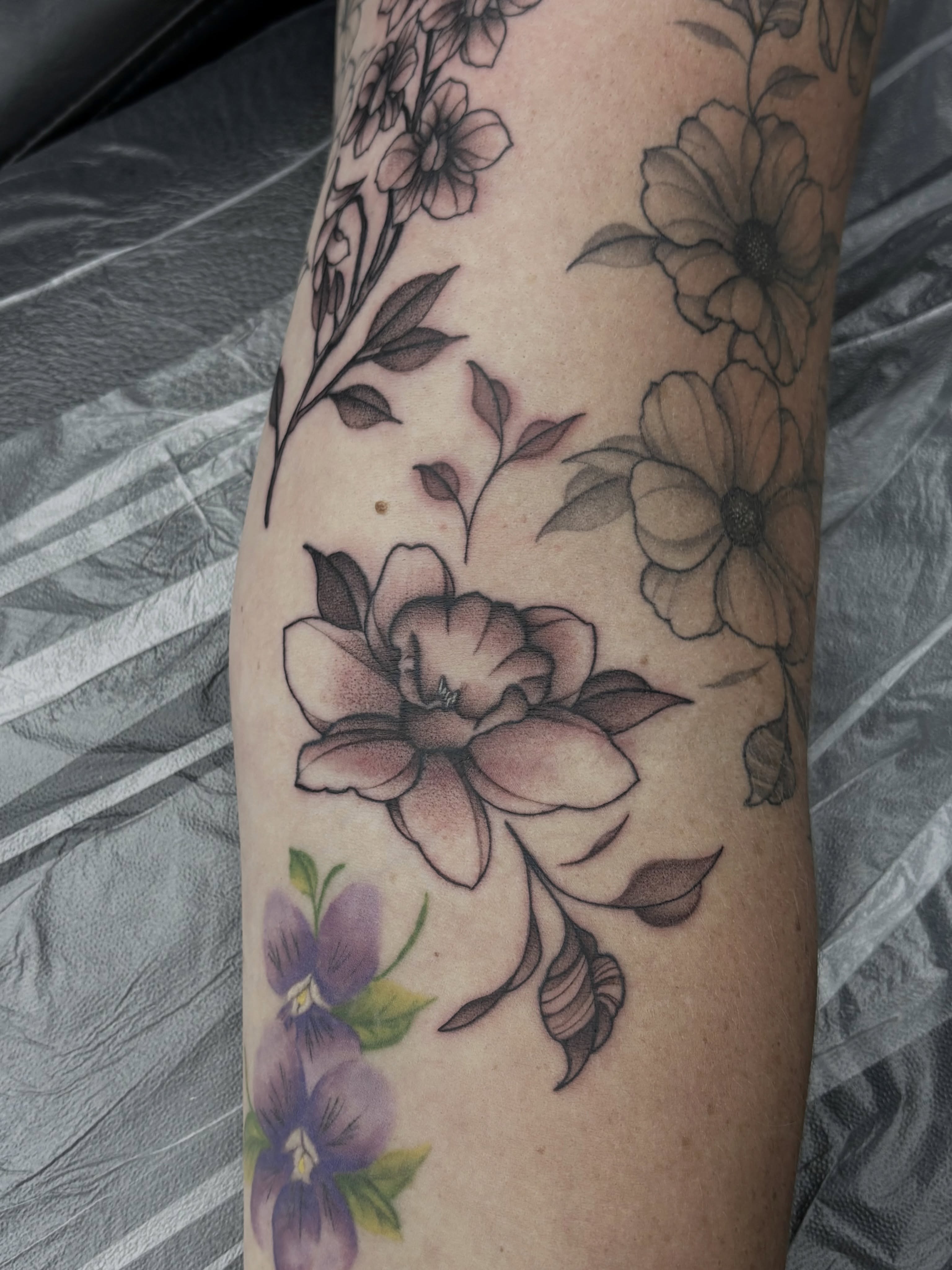 Floral arrangement black and grey tattoo on the forearm by Elise Lamoureux- Tattoo Artist, Airdrie, Alberta