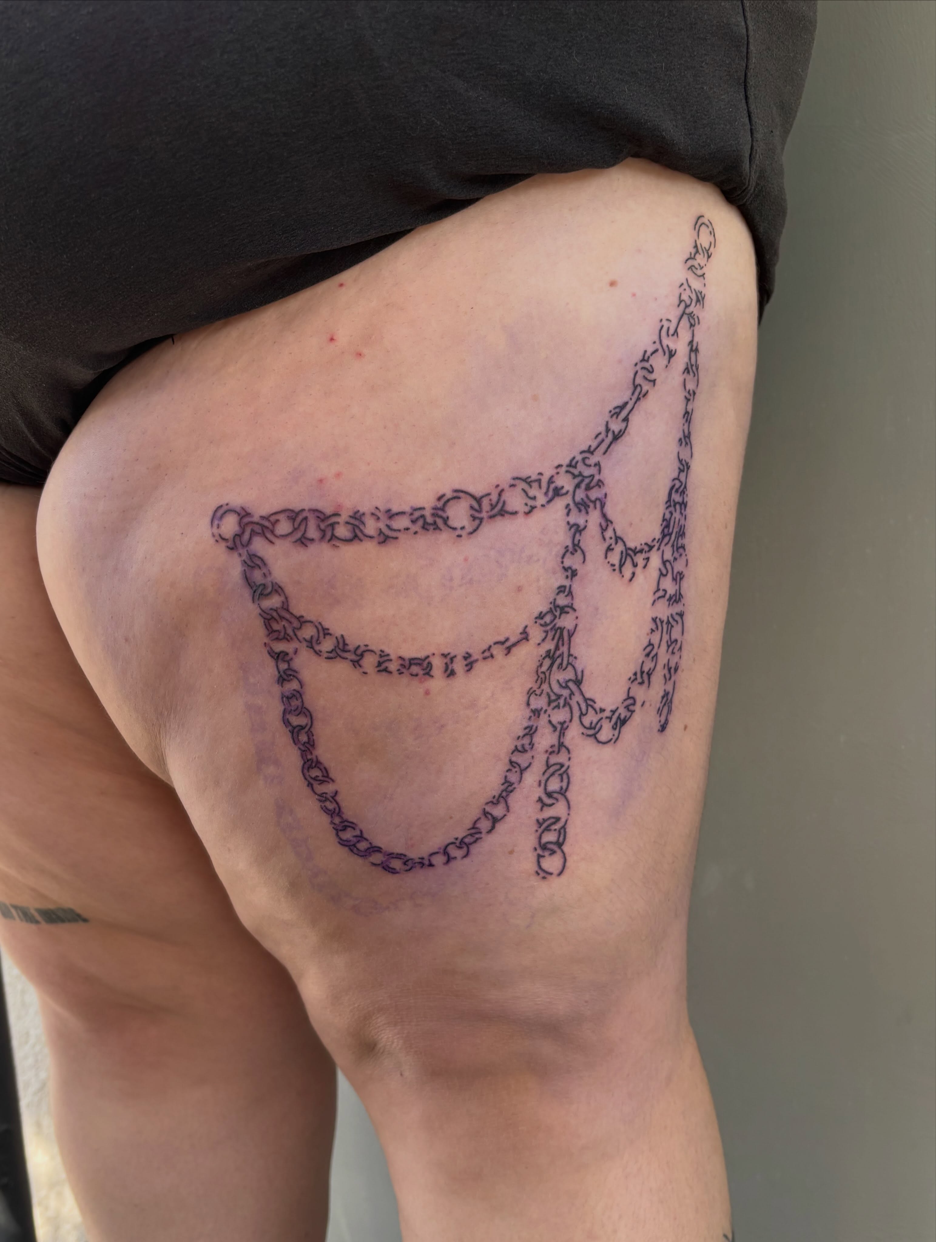 Chains black and grey tattoo on the thigh by Turner