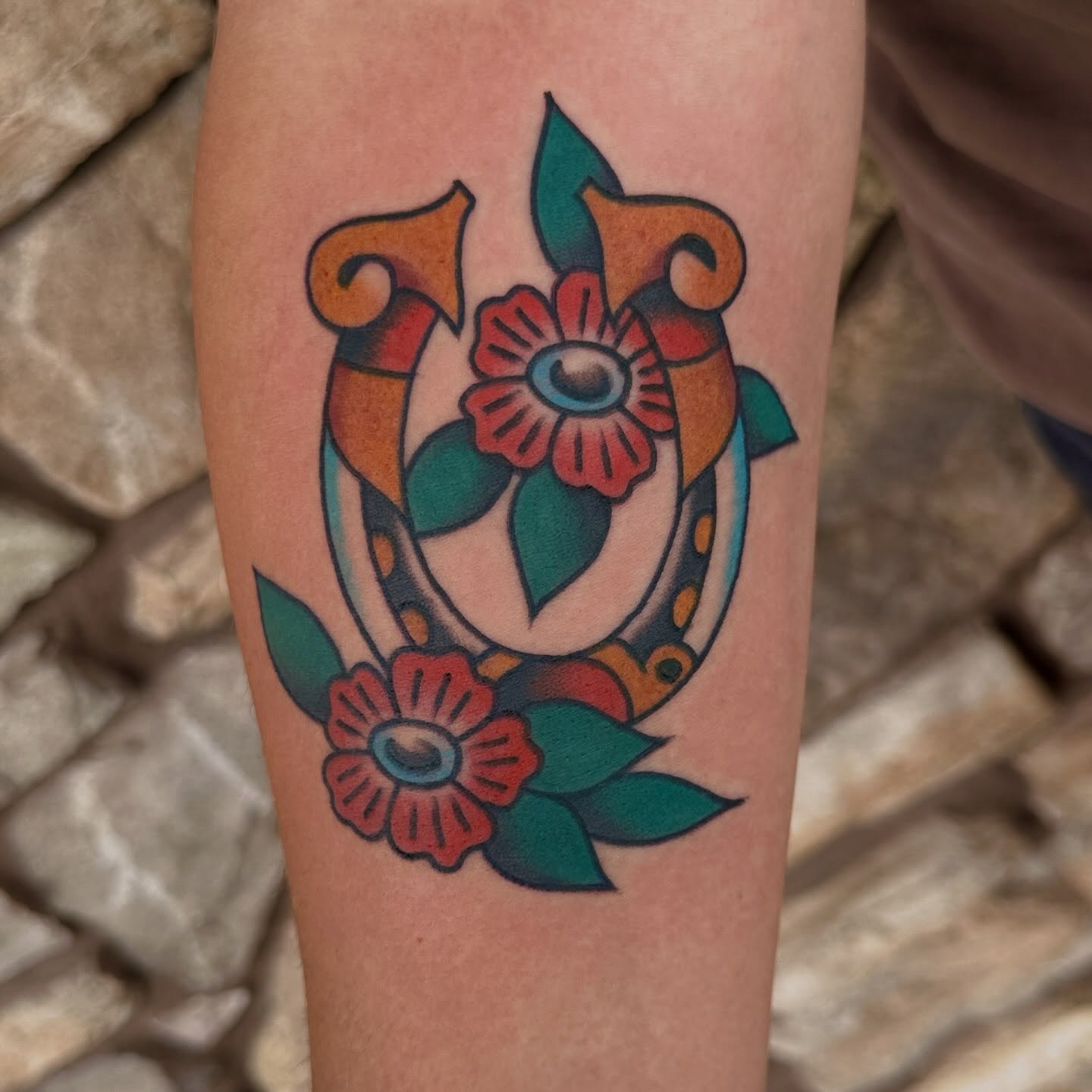 Floral anchor American traditional tattoo on the forearm by bryce duval