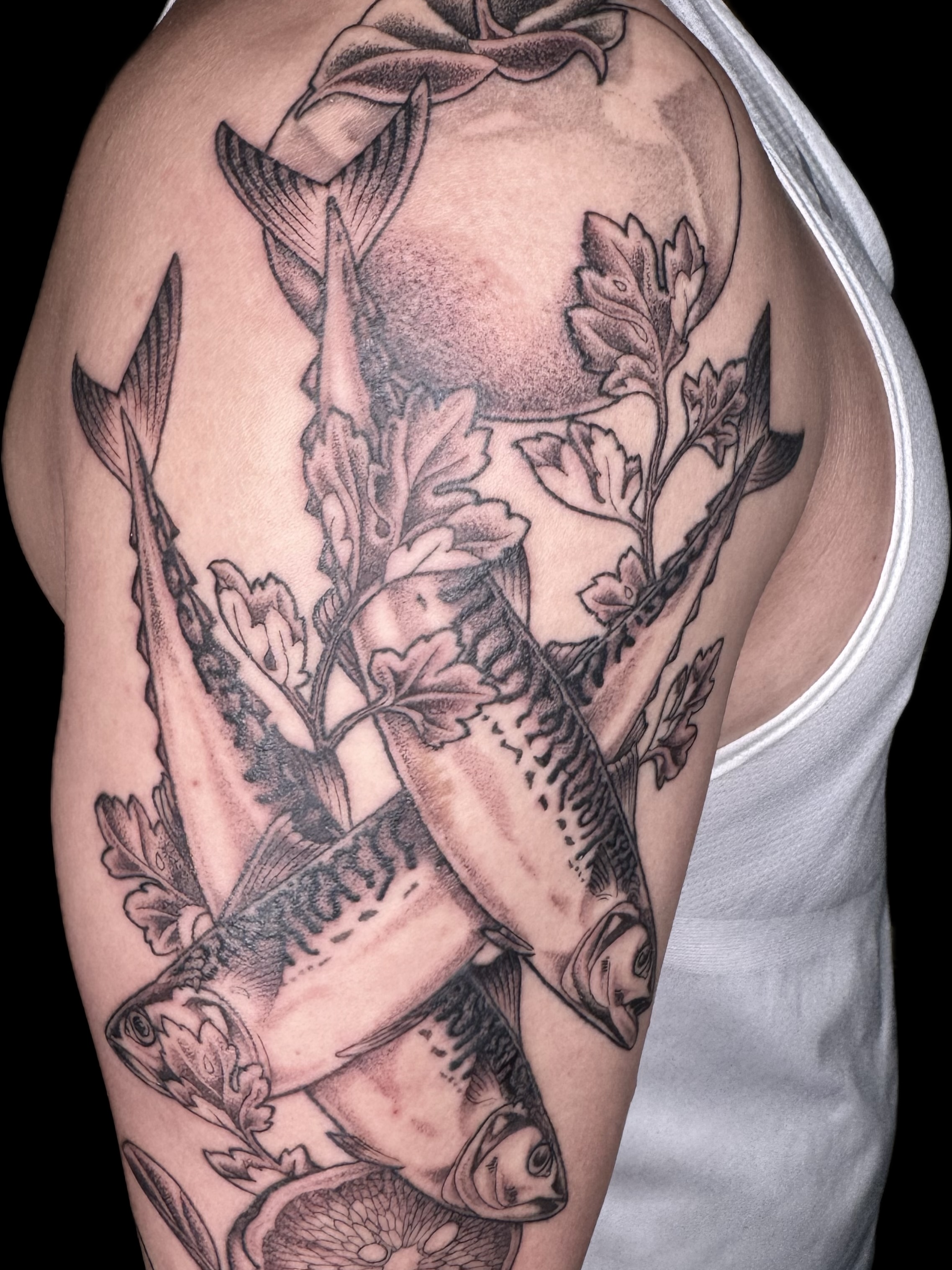 Fish and seaweed realism tattoo on the upper arm by Virginia 🥀Neo Traditional