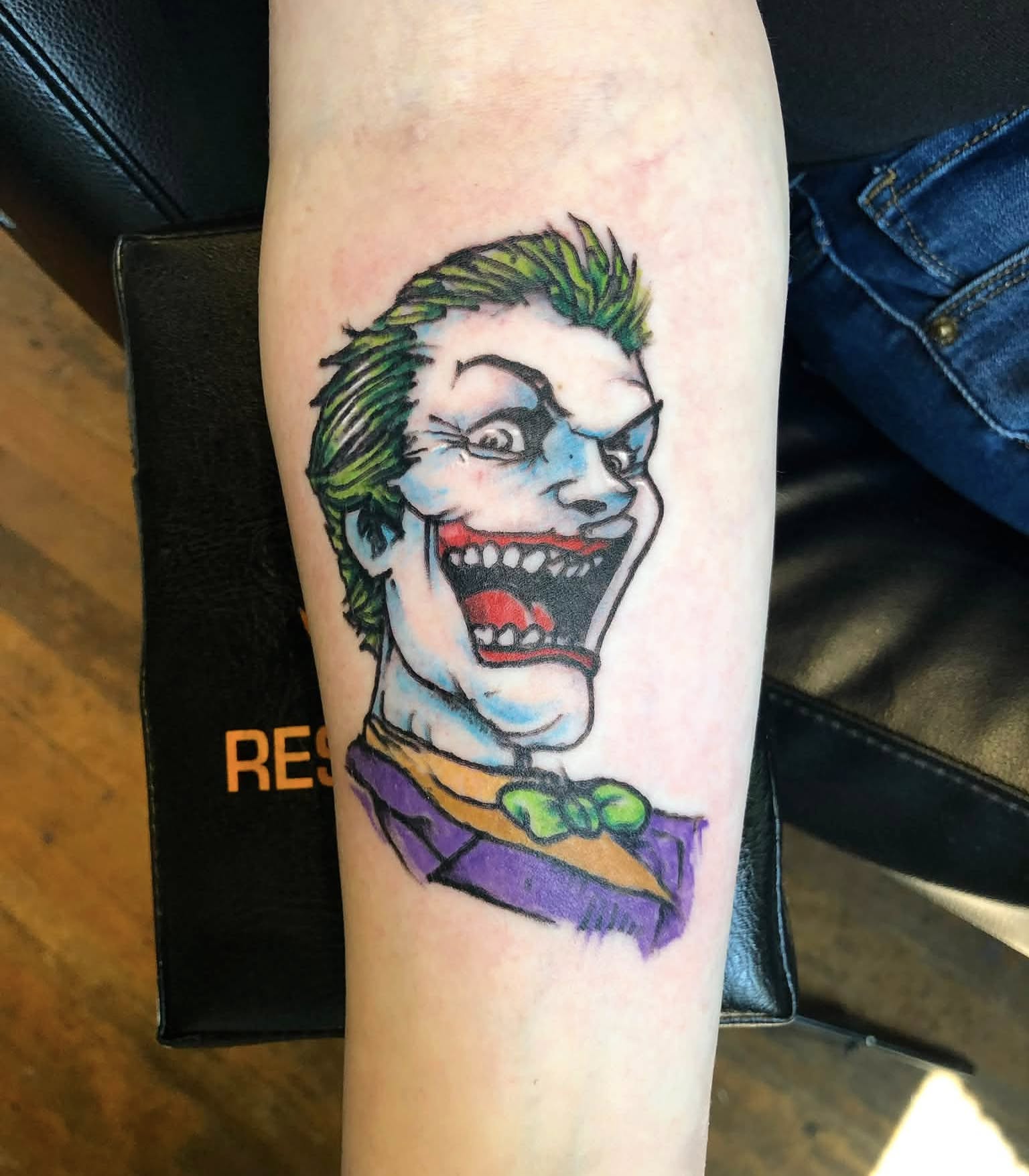 Joker American traditional tattoo on the forearm by Josh O’ + Bird ☘️ 🪶