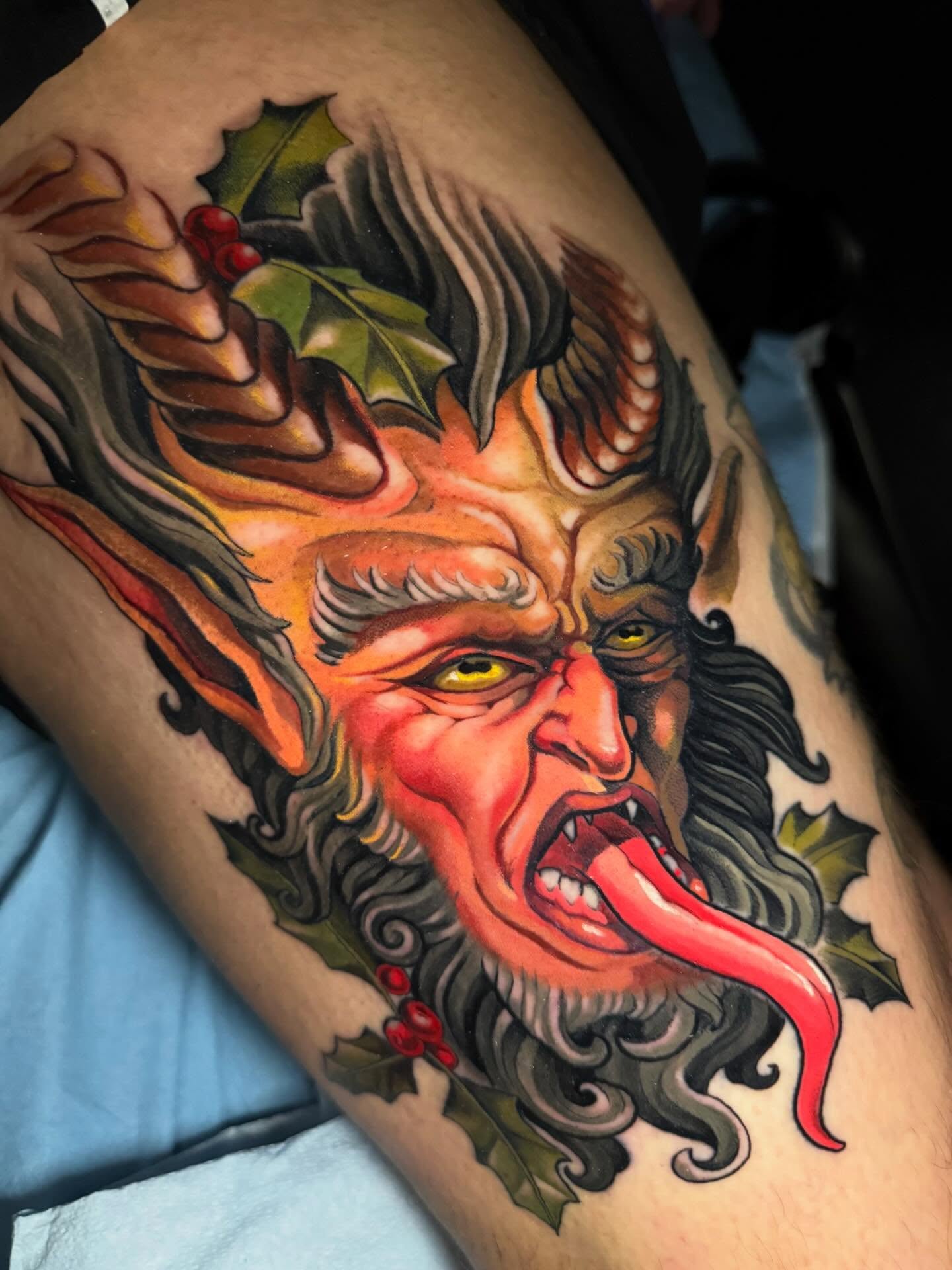 Demonic face American traditional tattoo on the thigh by Hayden Combs
