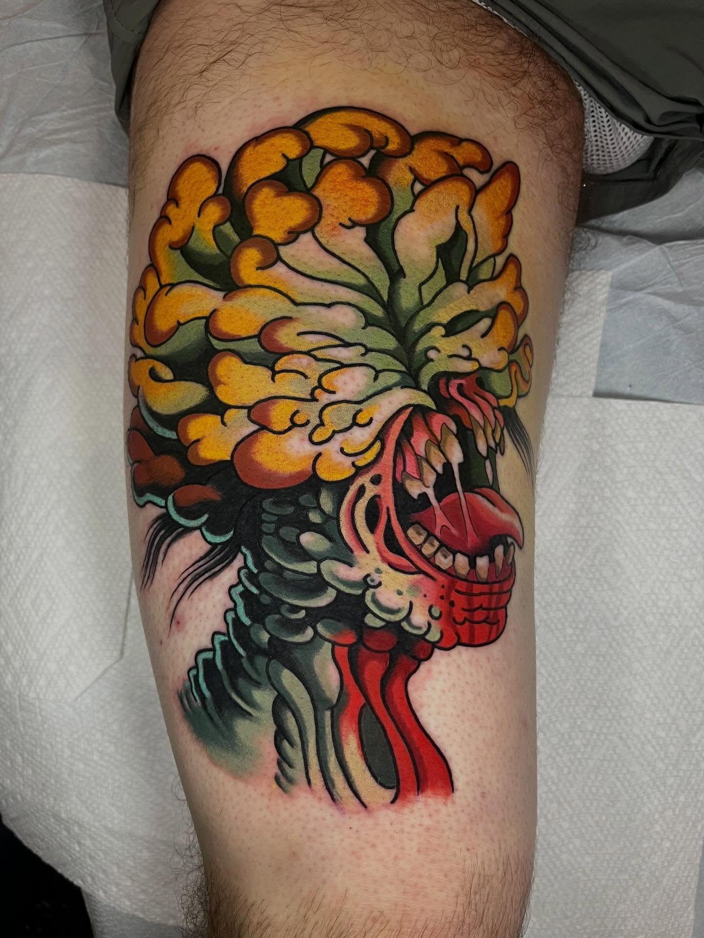 Floral skull American traditional tattoo on the thigh by Hayden Combs