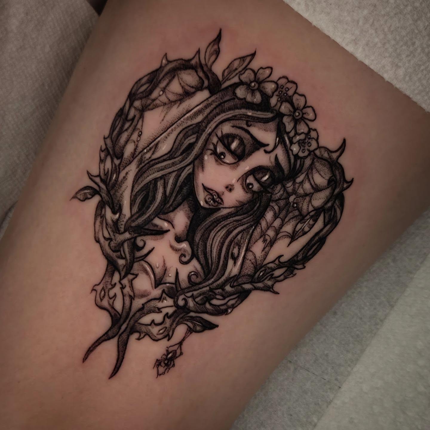 Woman with floral crown dotwork tattoo on the thigh by Devin 🖤