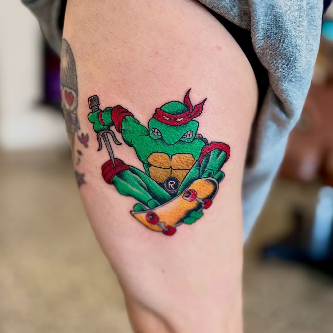 Skateboarding ninja turtle new school tattoo on the thigh by Jamie Hall, Kansas City, Missouri