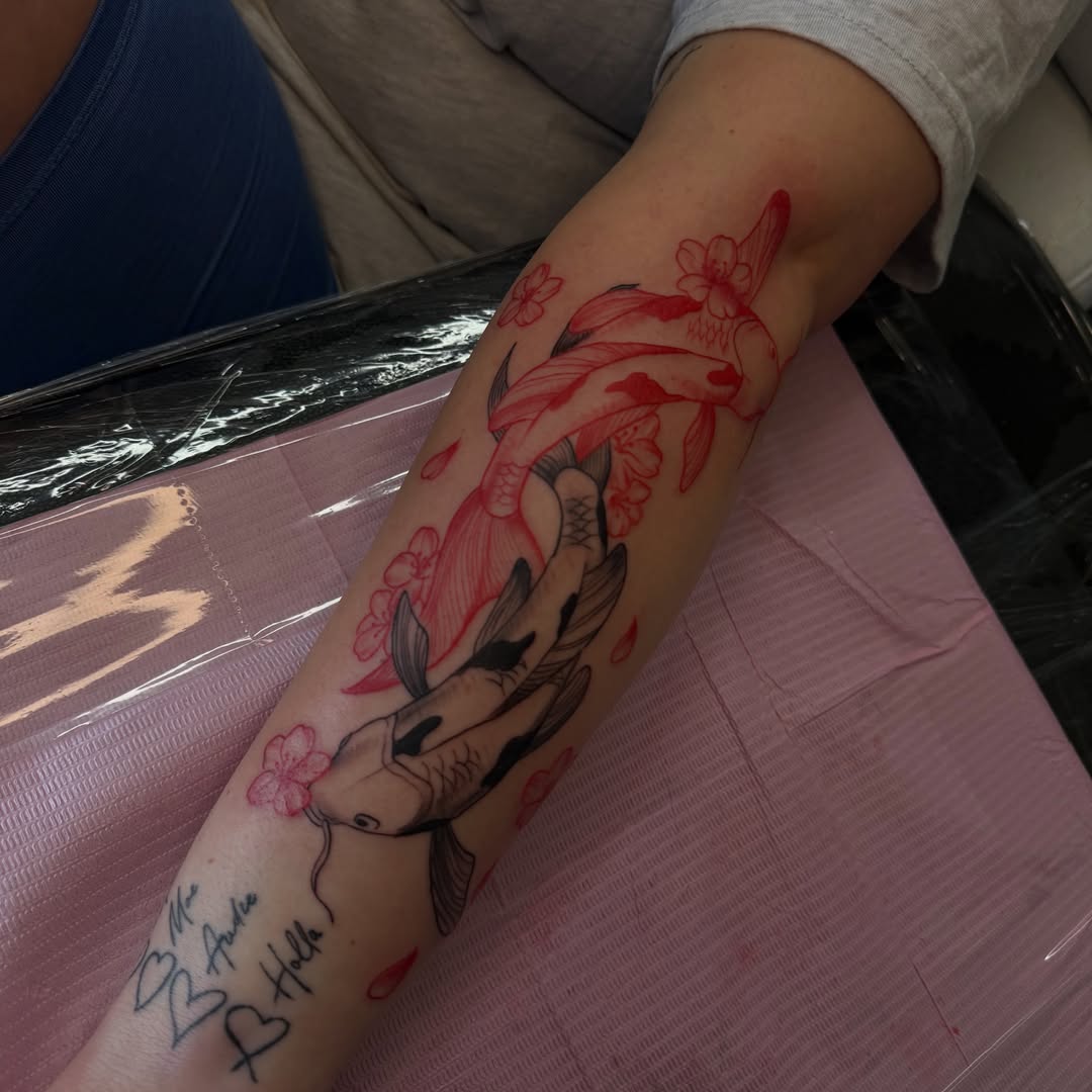 Koi fish and cherry blossoms japanese irezumi tattoo on the forearm by Nina Nichole