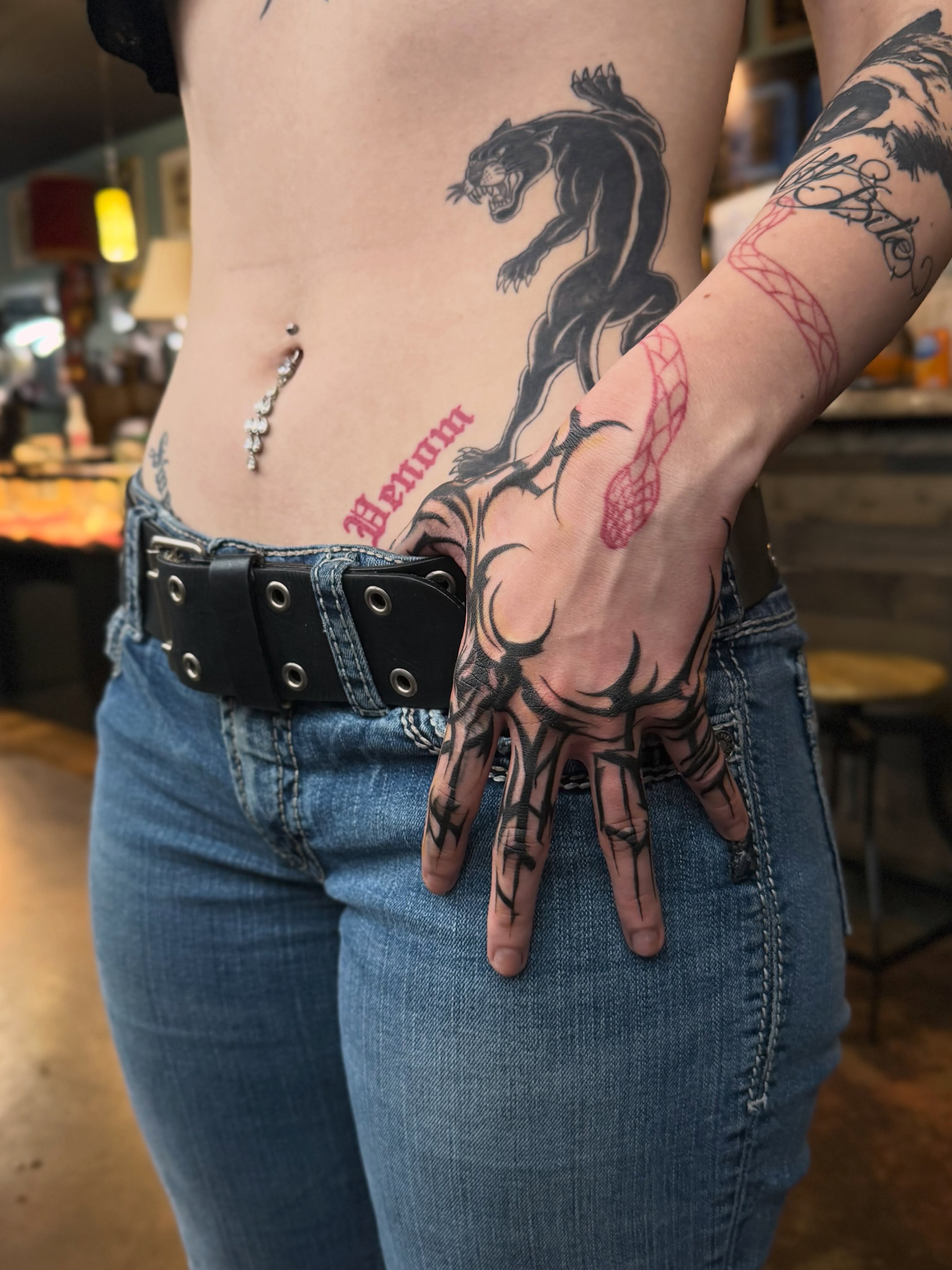 Panther and hand black and grey tattoo on the torso by Lu Ve, Dayton, Ohio