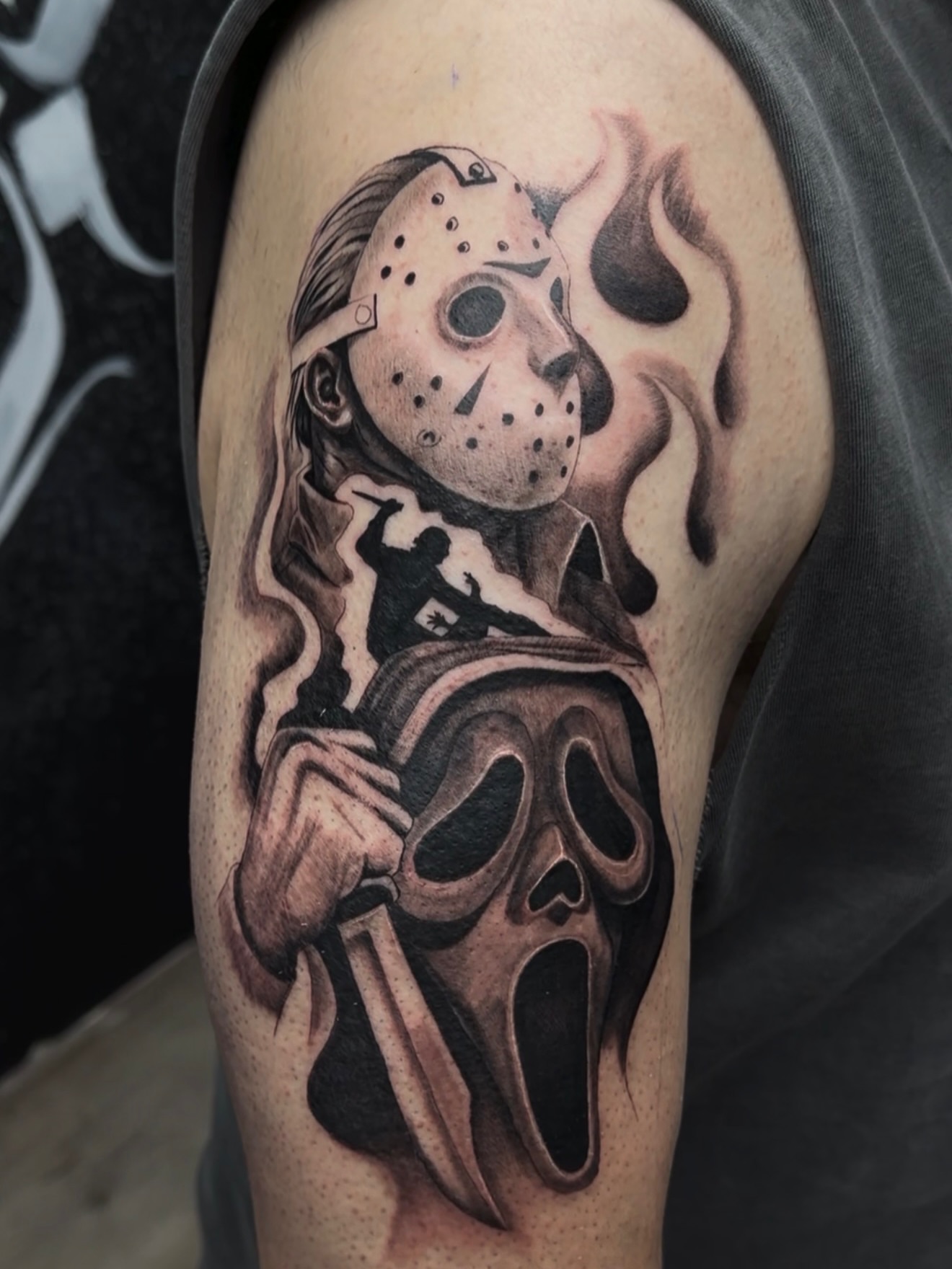 Mask and scream mask realism tattoo on the upper arm by 🐺