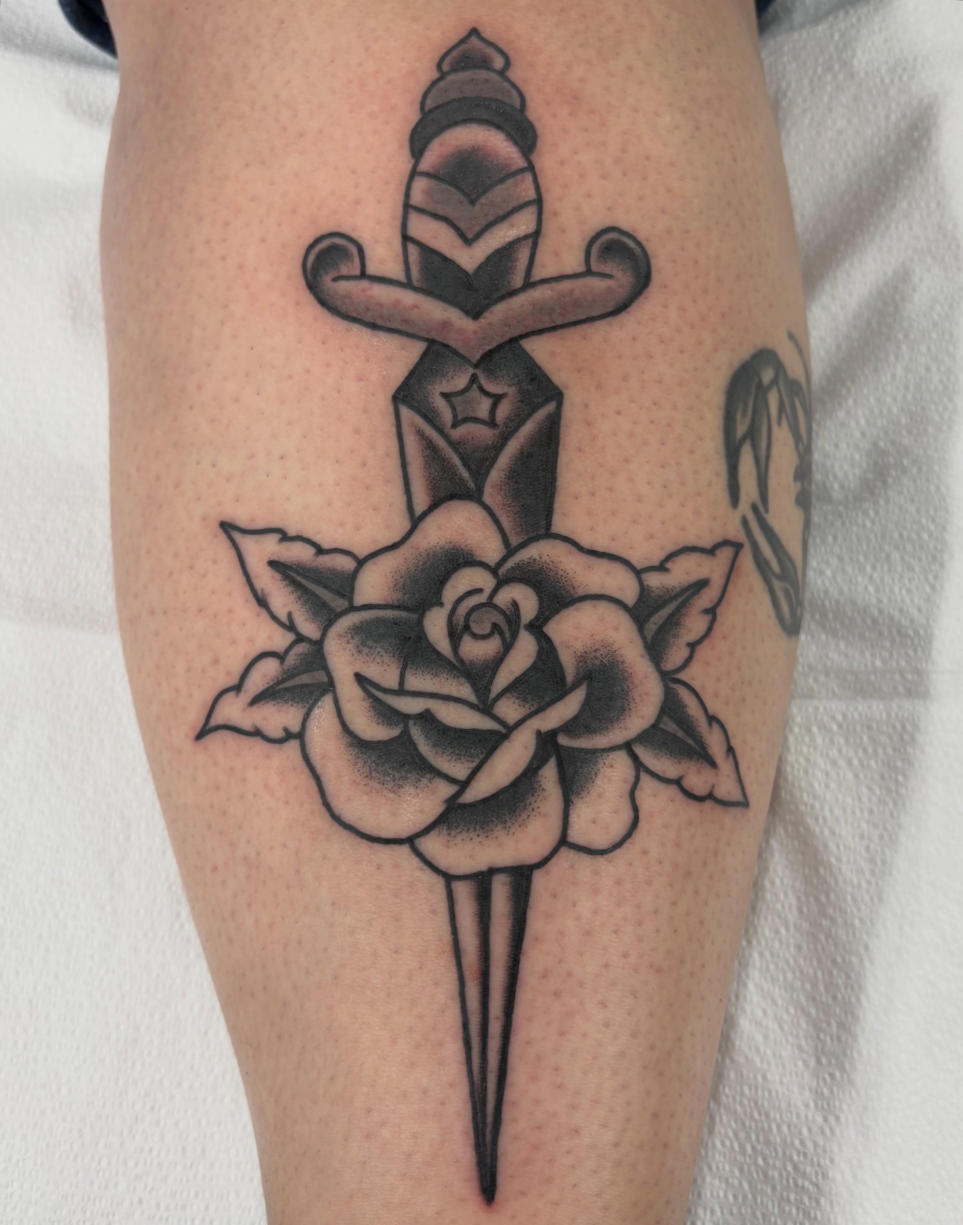 Sword through rose American traditional tattoo on the forearm by Aysia Mankin-Wong, San Francisco, California
