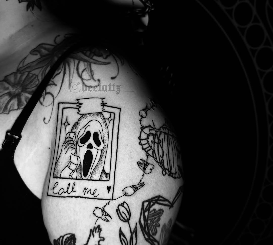 Ghost mask dotwork tattoo on the shoulder by Brinkley McGill