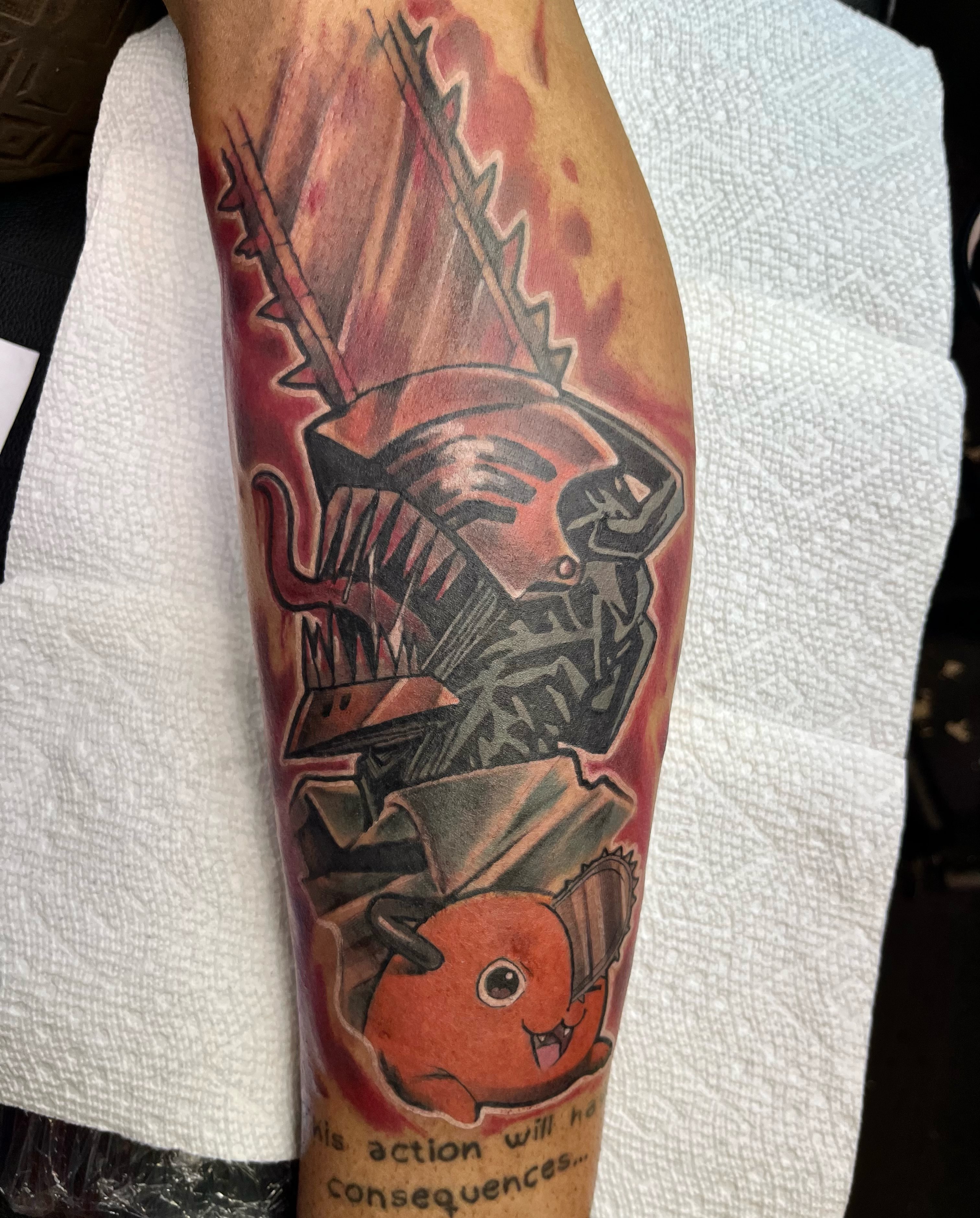Alien and Charmander dark realism tattoo on the forearm by Darius Armour (Tattoo Artist)