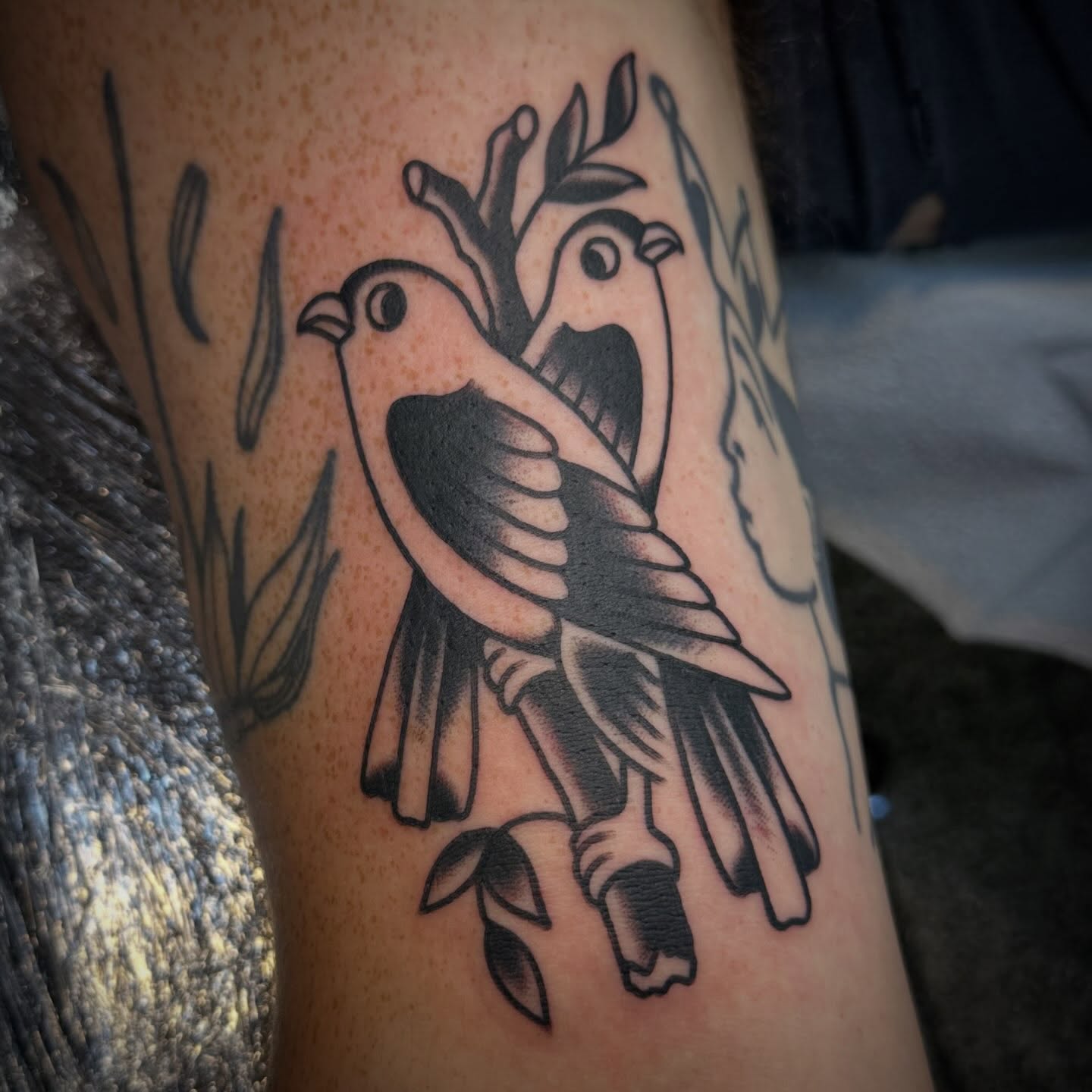 Birds American traditional tattoo on the thigh by Nathan Rohrbacher, Nashville, Tennessee