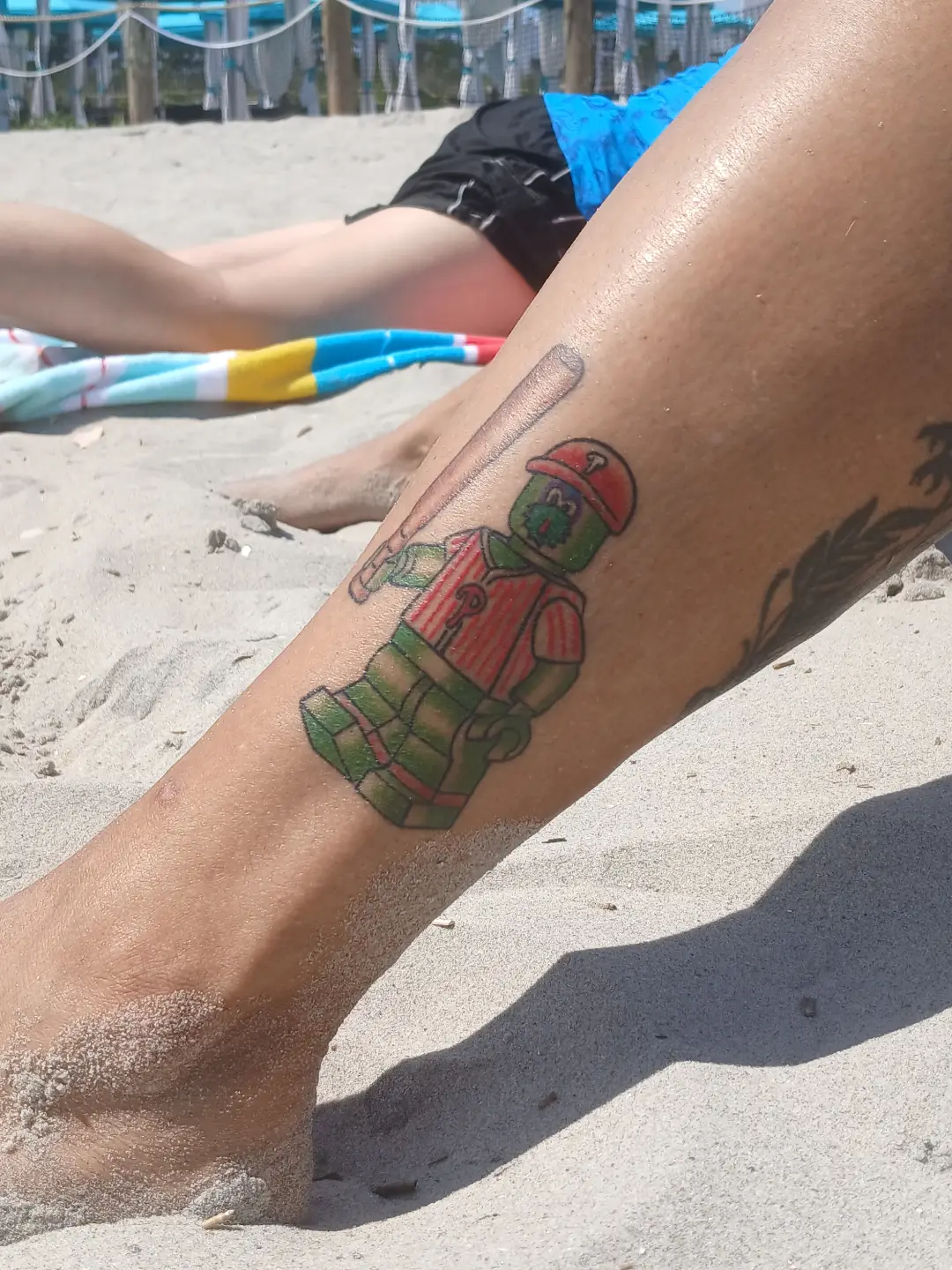 Baseball player American traditional tattoo on the leg by Amber Tattoos