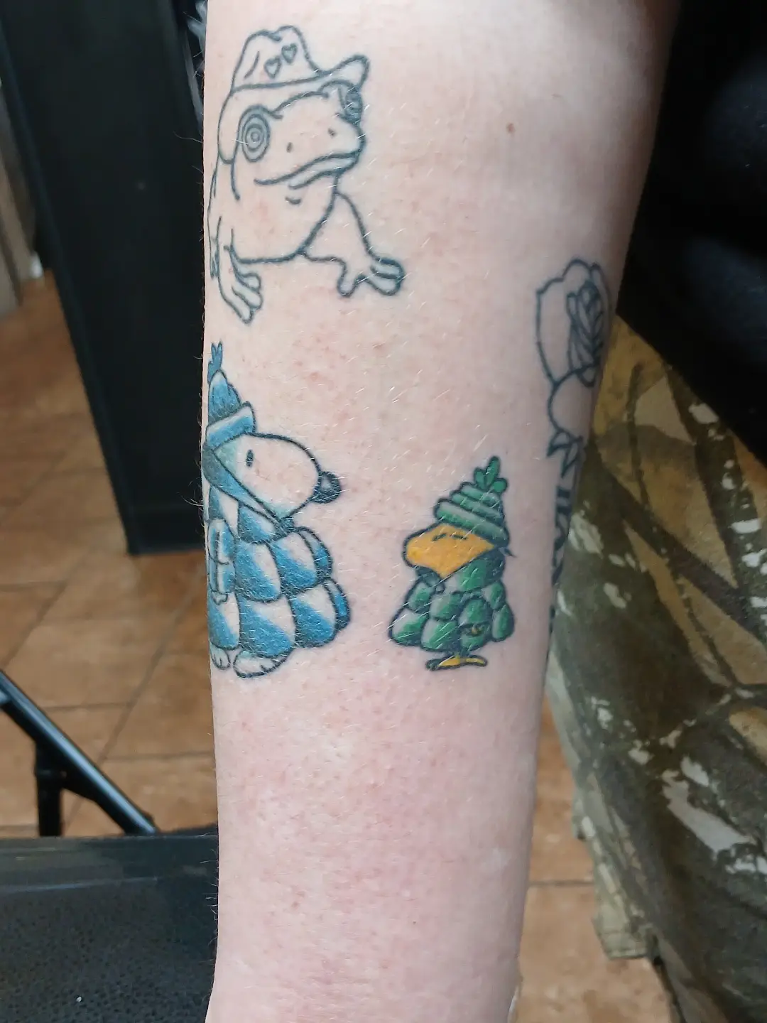 Cartoon characters illustrative tattoo on the forearm by Amber Tattoos