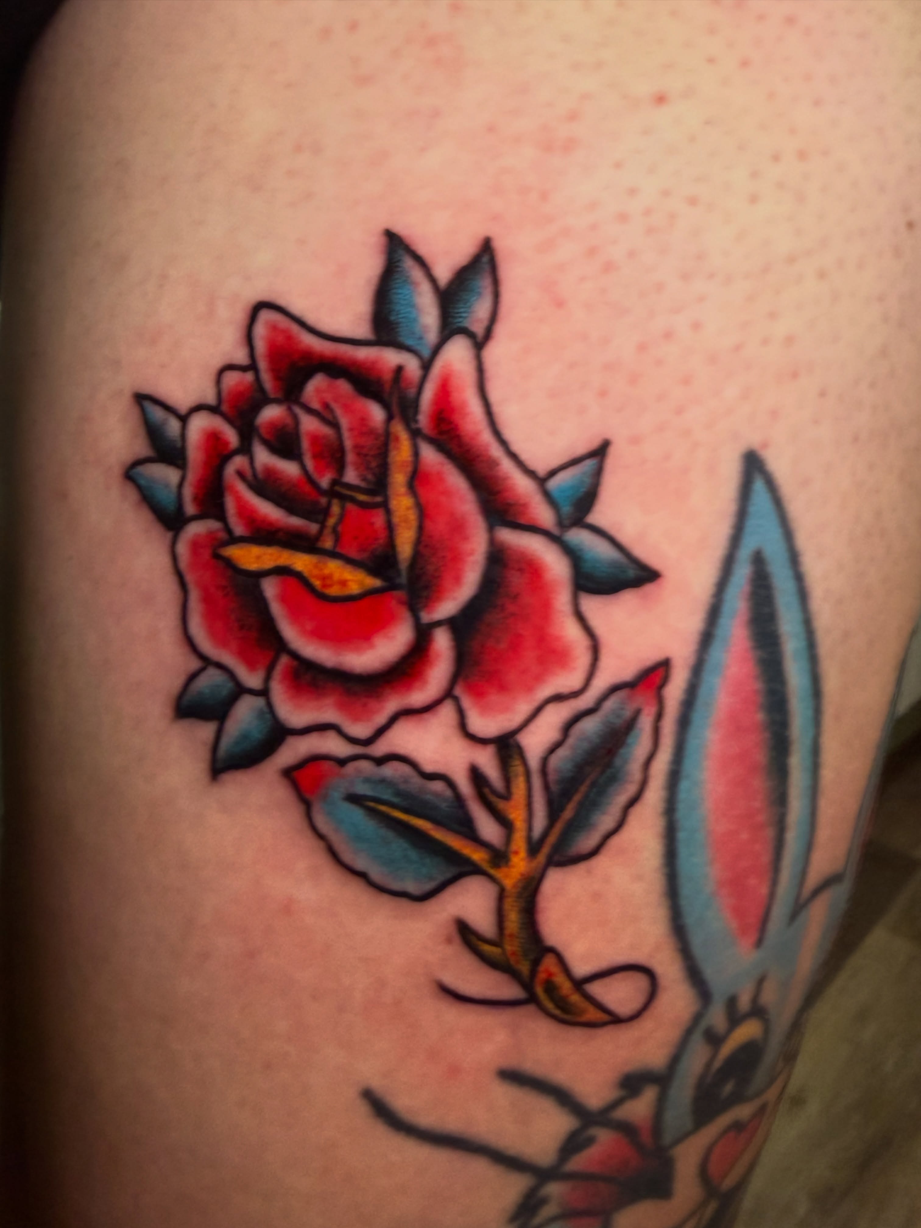 Rose American traditional tattoo on the thigh by Giuseppe T.C.