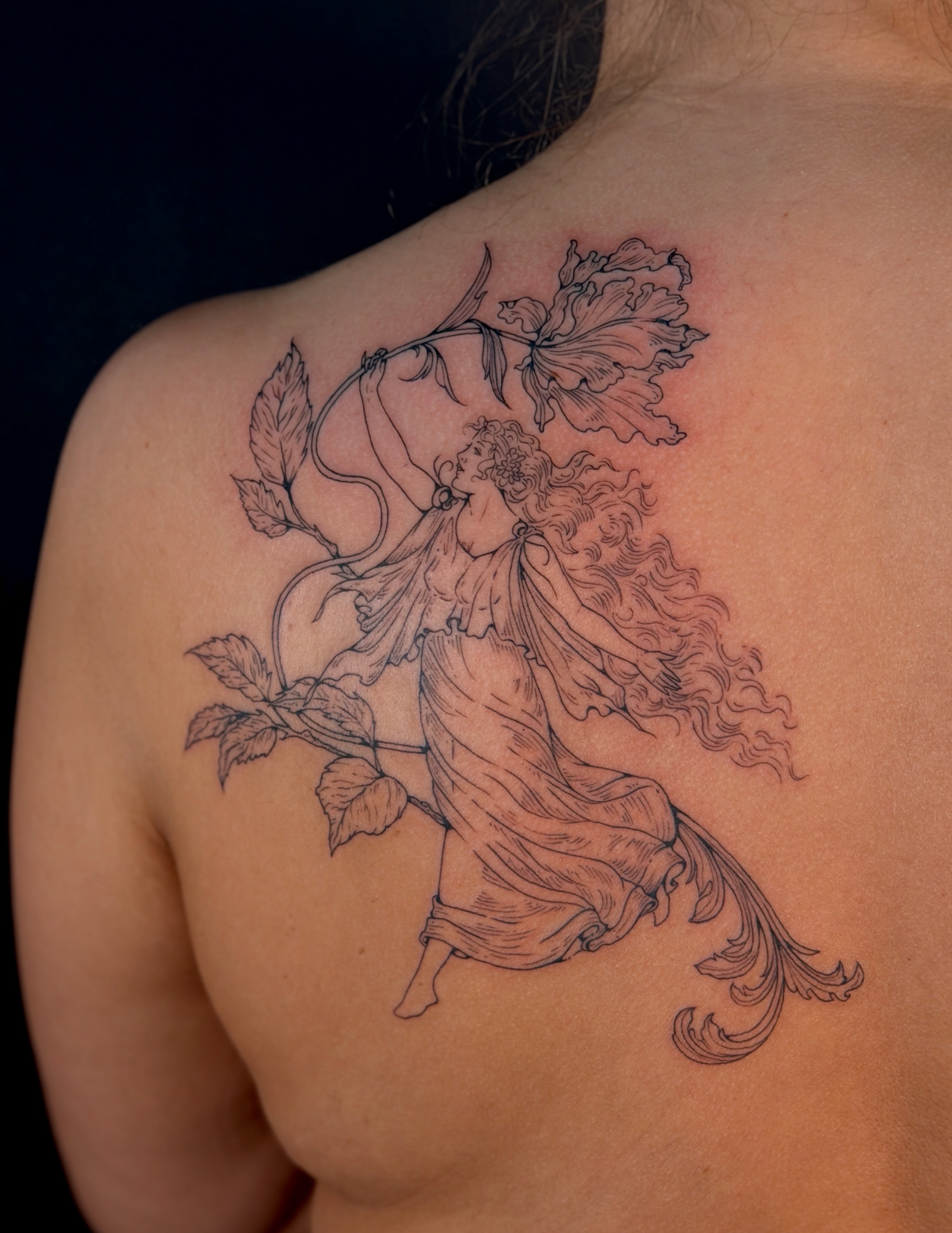 Woman with flowers realism tattoo on the back by Kail