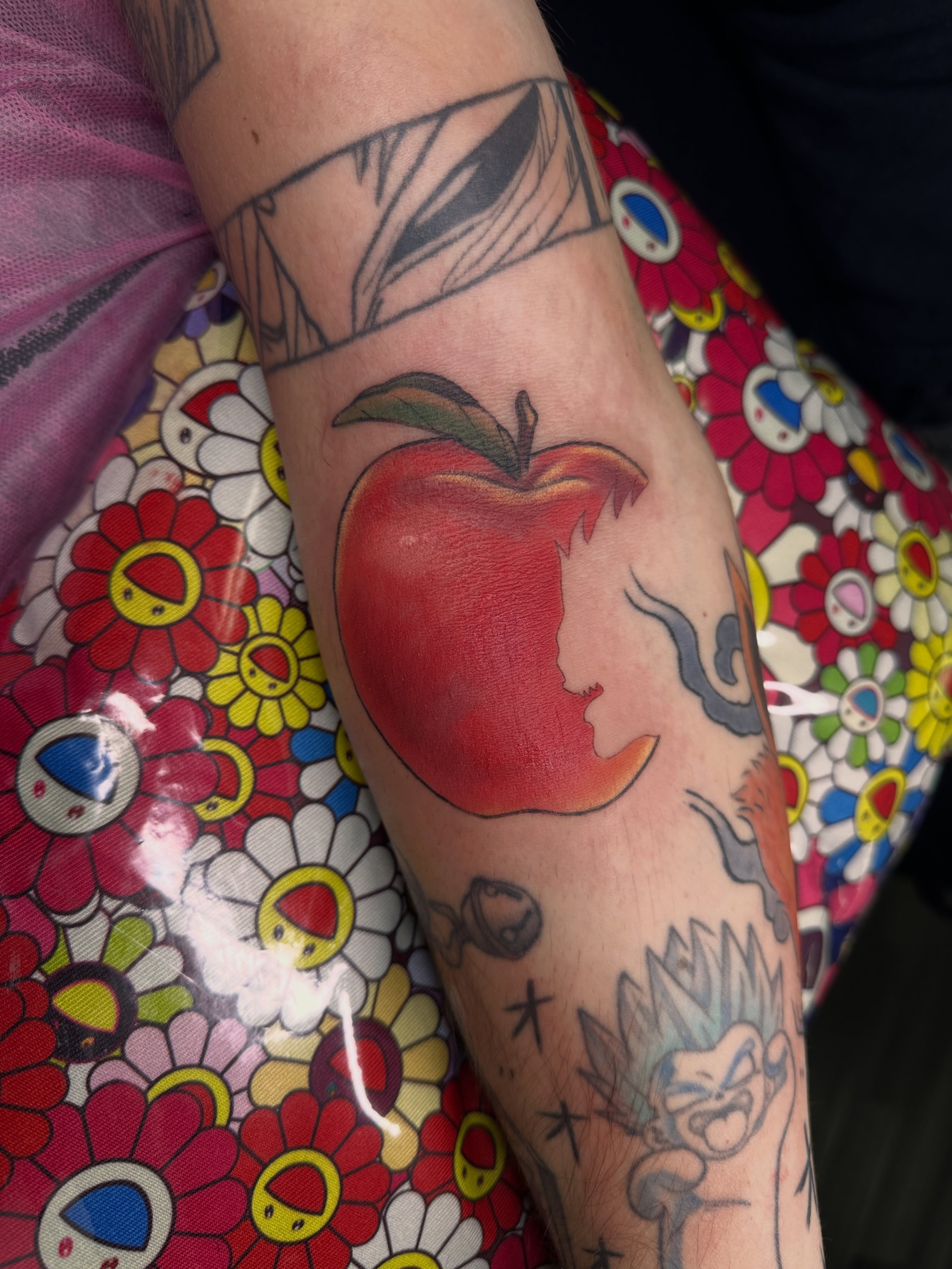Apple realism tattoo on the forearm by Shrimple
