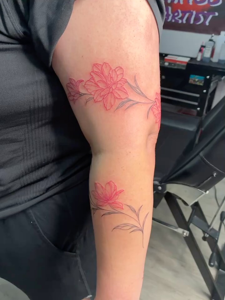 Flowers fine line tattoo on the forearm by Tattoos by Hailey