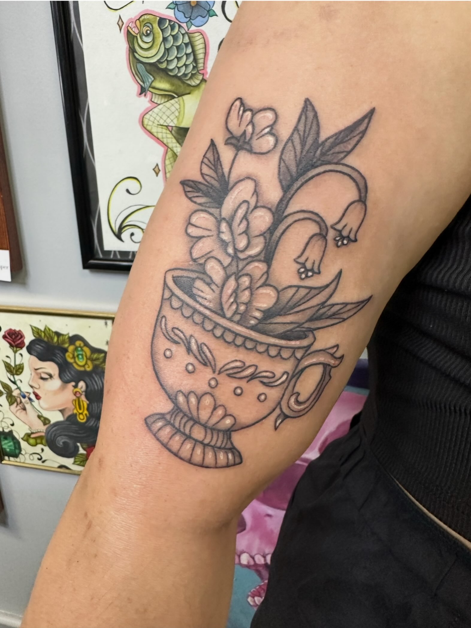 Tea cup with flowers American traditional tattoo on the forearm by Lindsey Bendsey