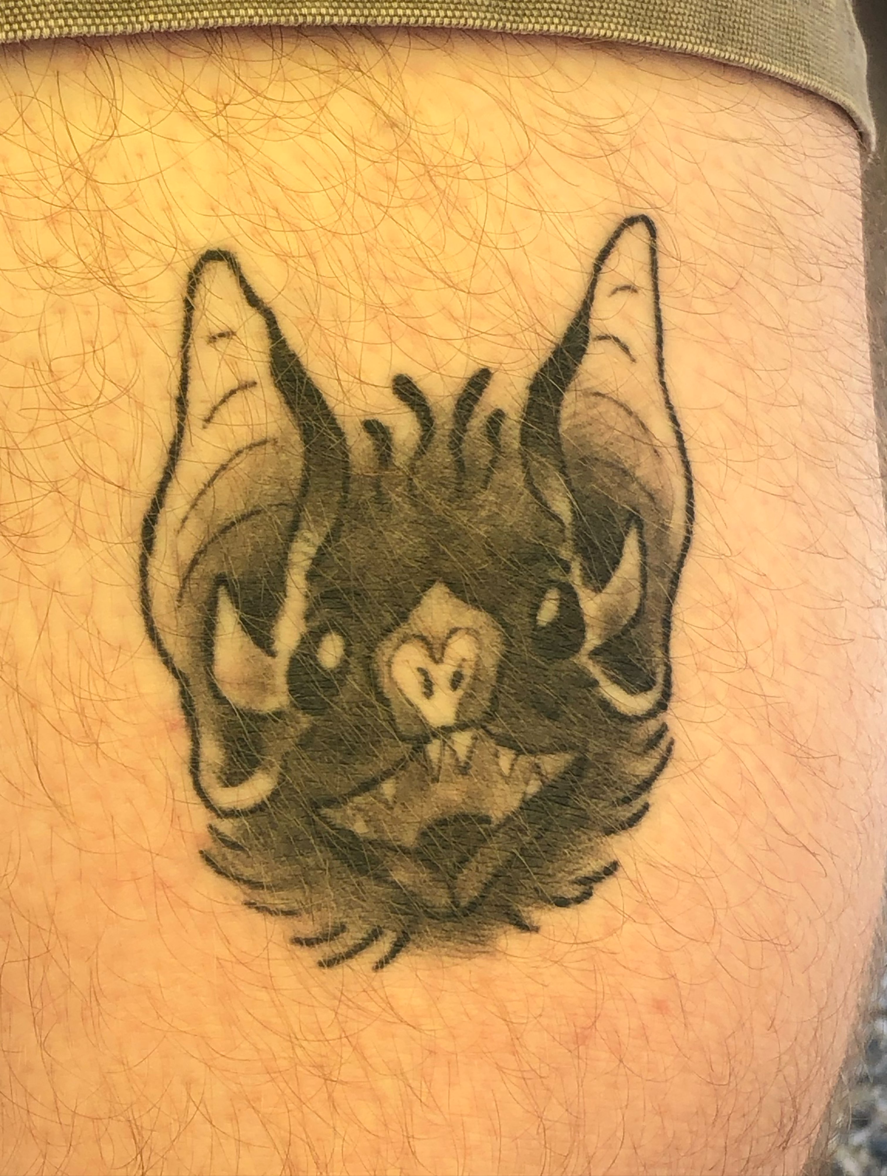 Bat black and grey tattoo on the thigh by Rowan Lee