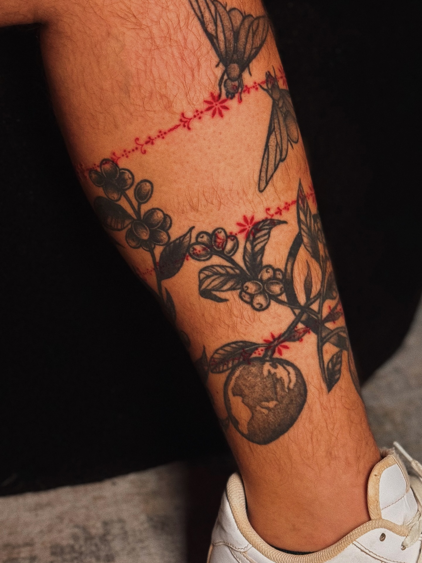 Coffee plant black and grey tattoo on the forearm by Luisa Duarte