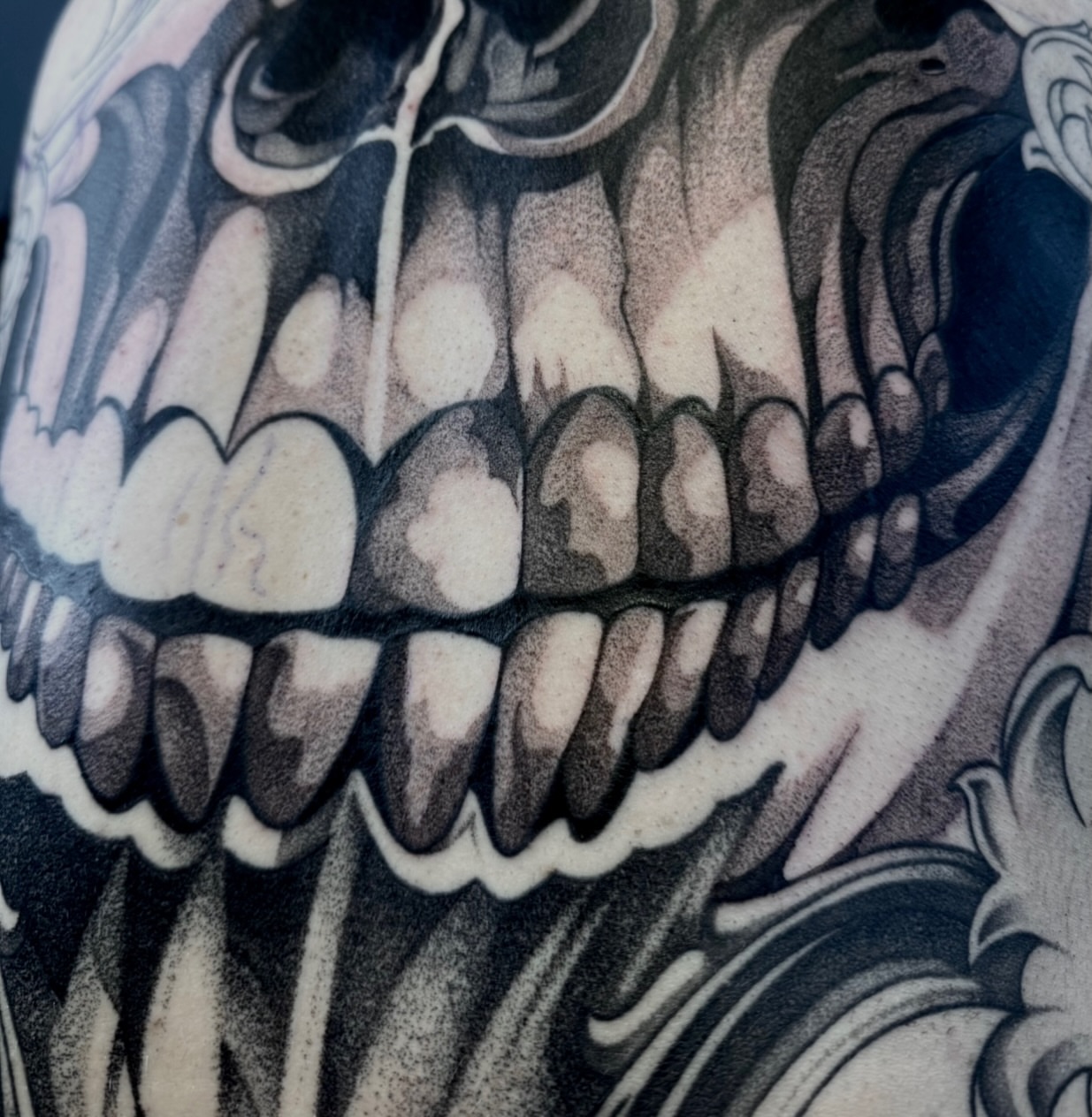 Grinning skull black and grey tattoo on the forearm by Ki ☆ SLC TATTOO ARTIST