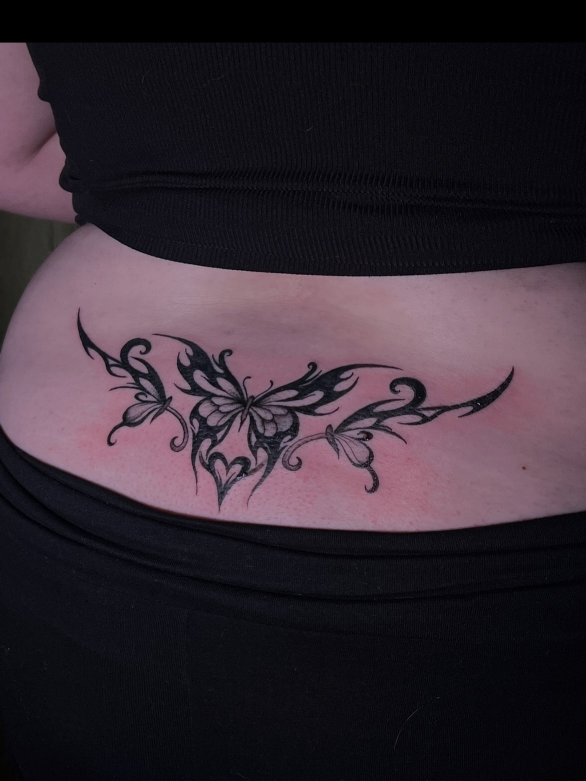Butterfly tribal tattoo on the torso by V