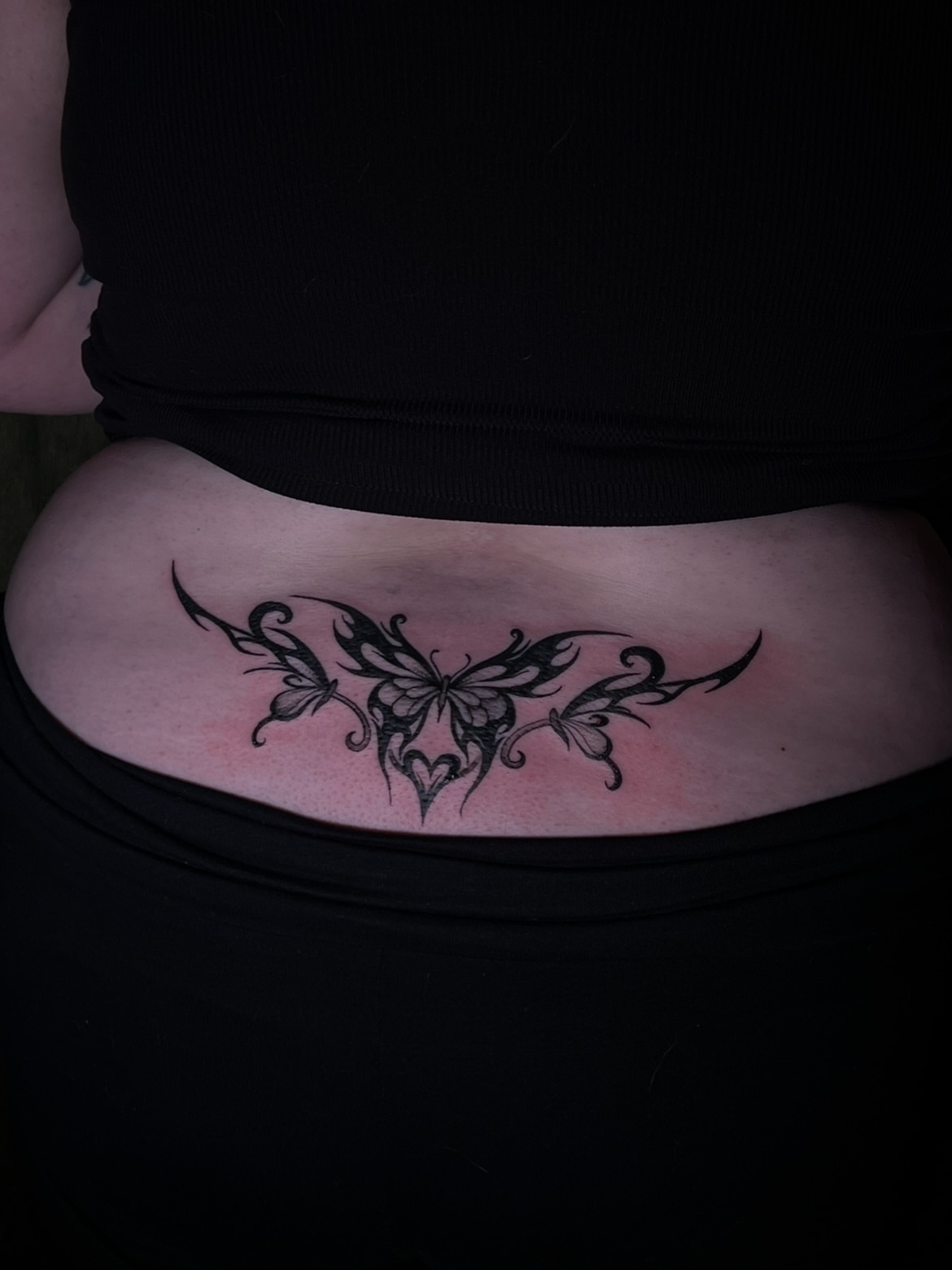 Butterfly tribal tattoo on the torso by V