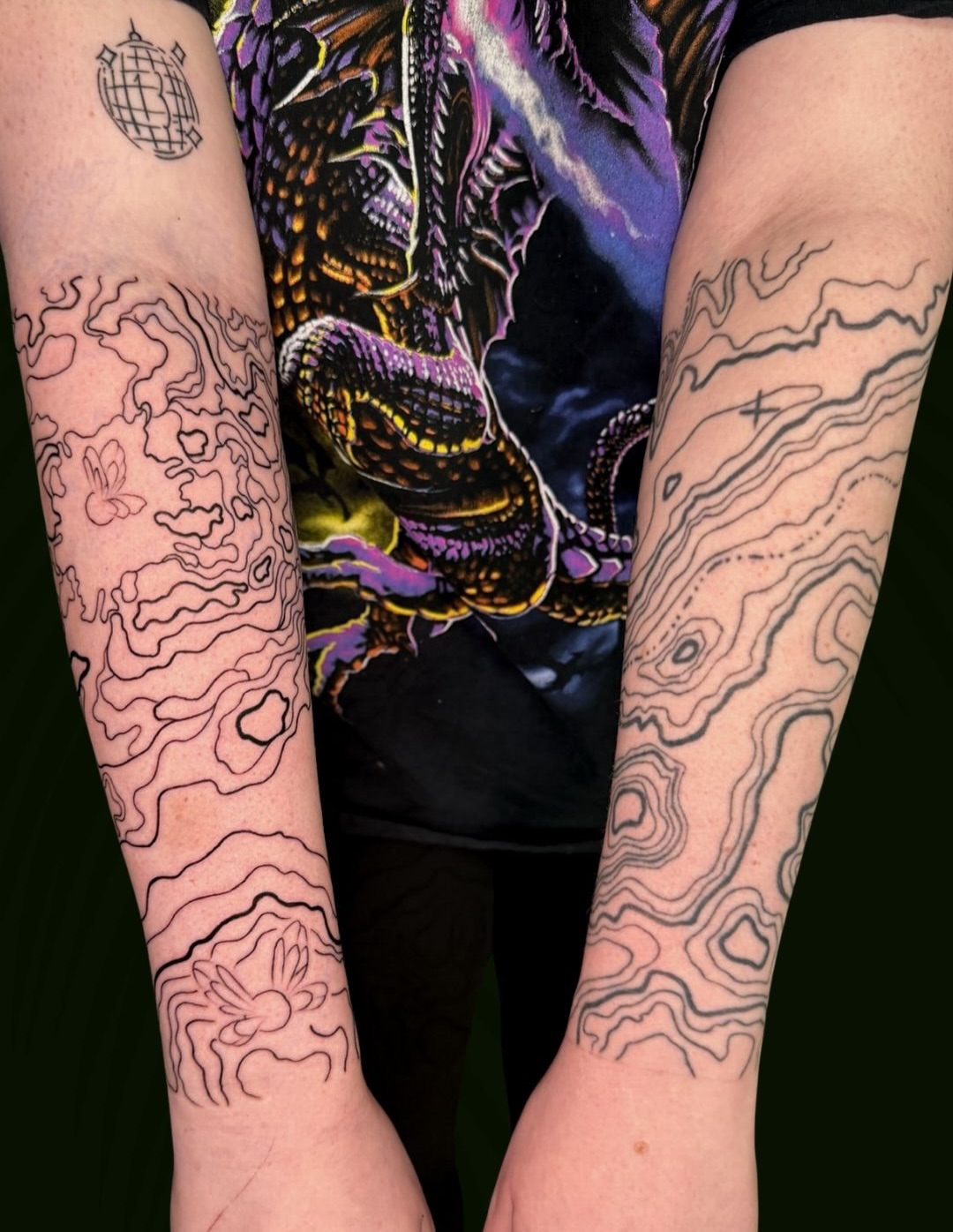 Topographic map black and grey tattoo on the forearm by Sarah Margaret