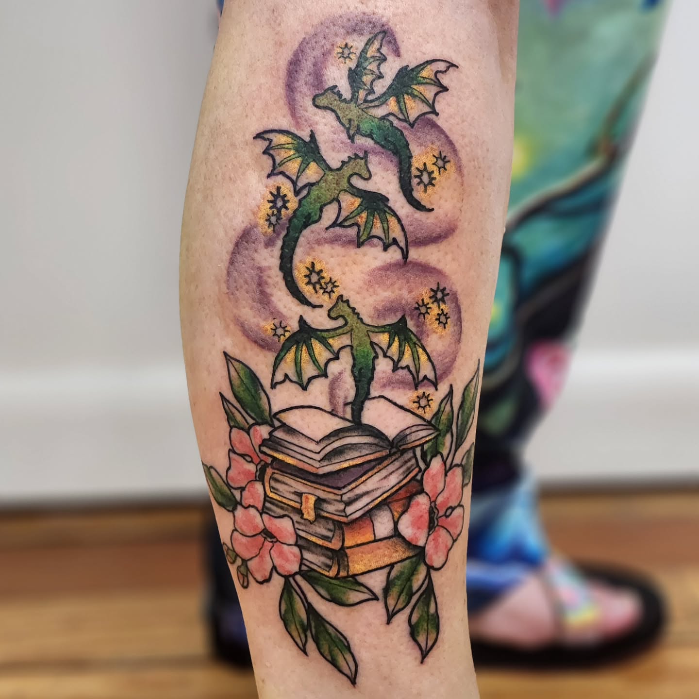 Dragons and books new school tattoo on the forearm by Sonya ๐ฟ๐ธ๐พ