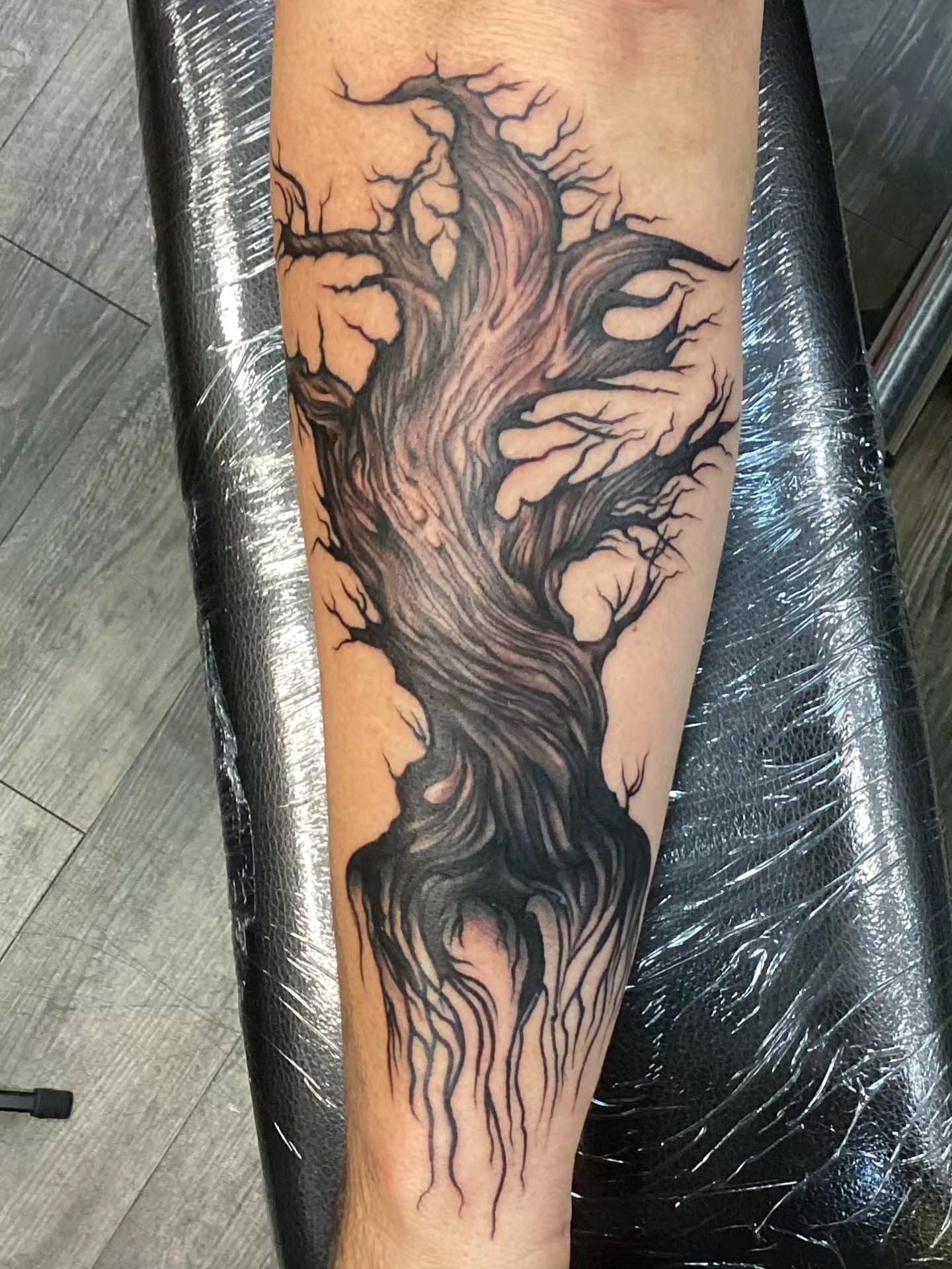 Tattoo by @crucible.ink — black_and_grey, realism