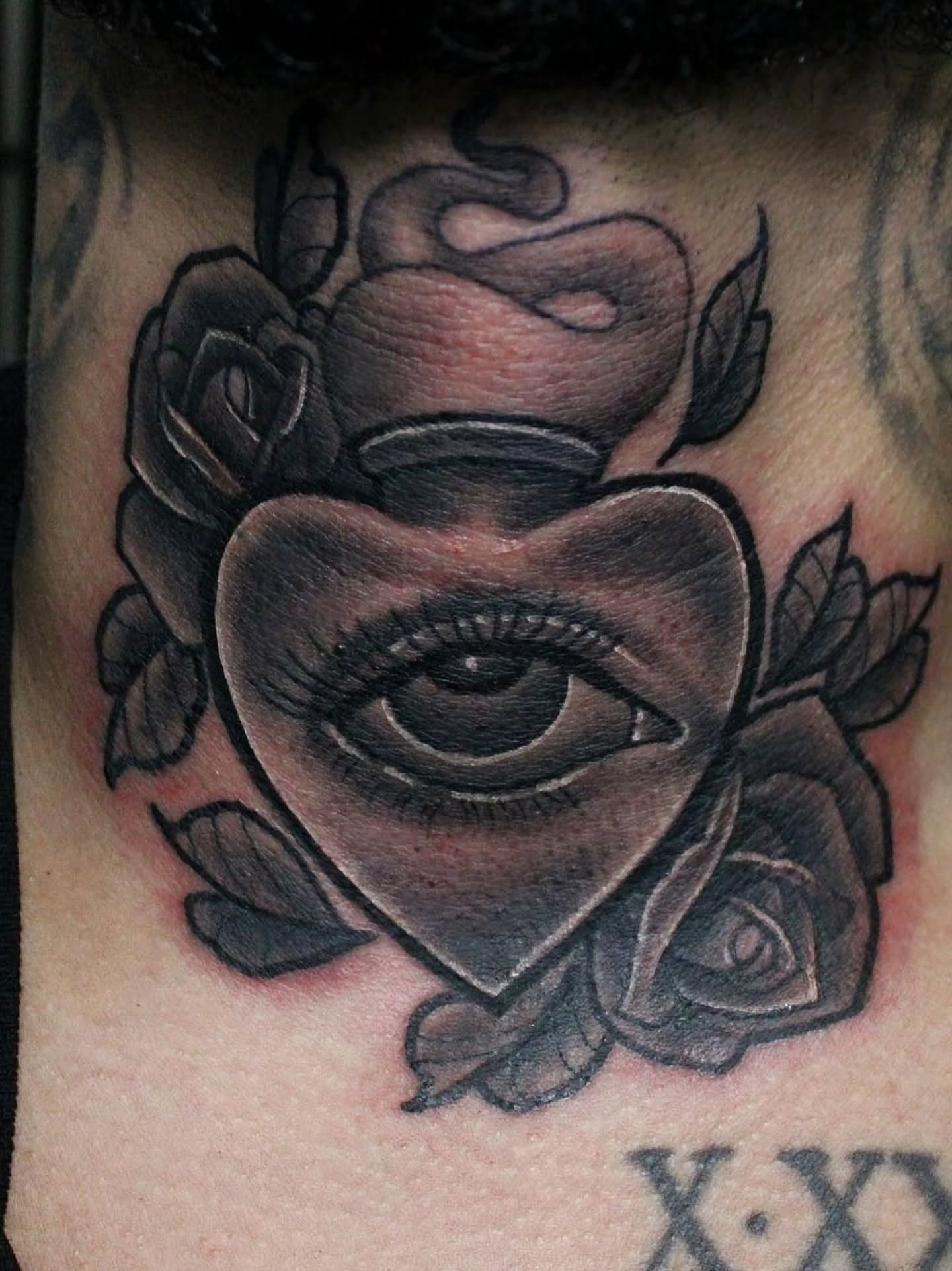 Eye within heart American traditional tattoo on the chest by Joey Vinci, Phoenix, Arizona