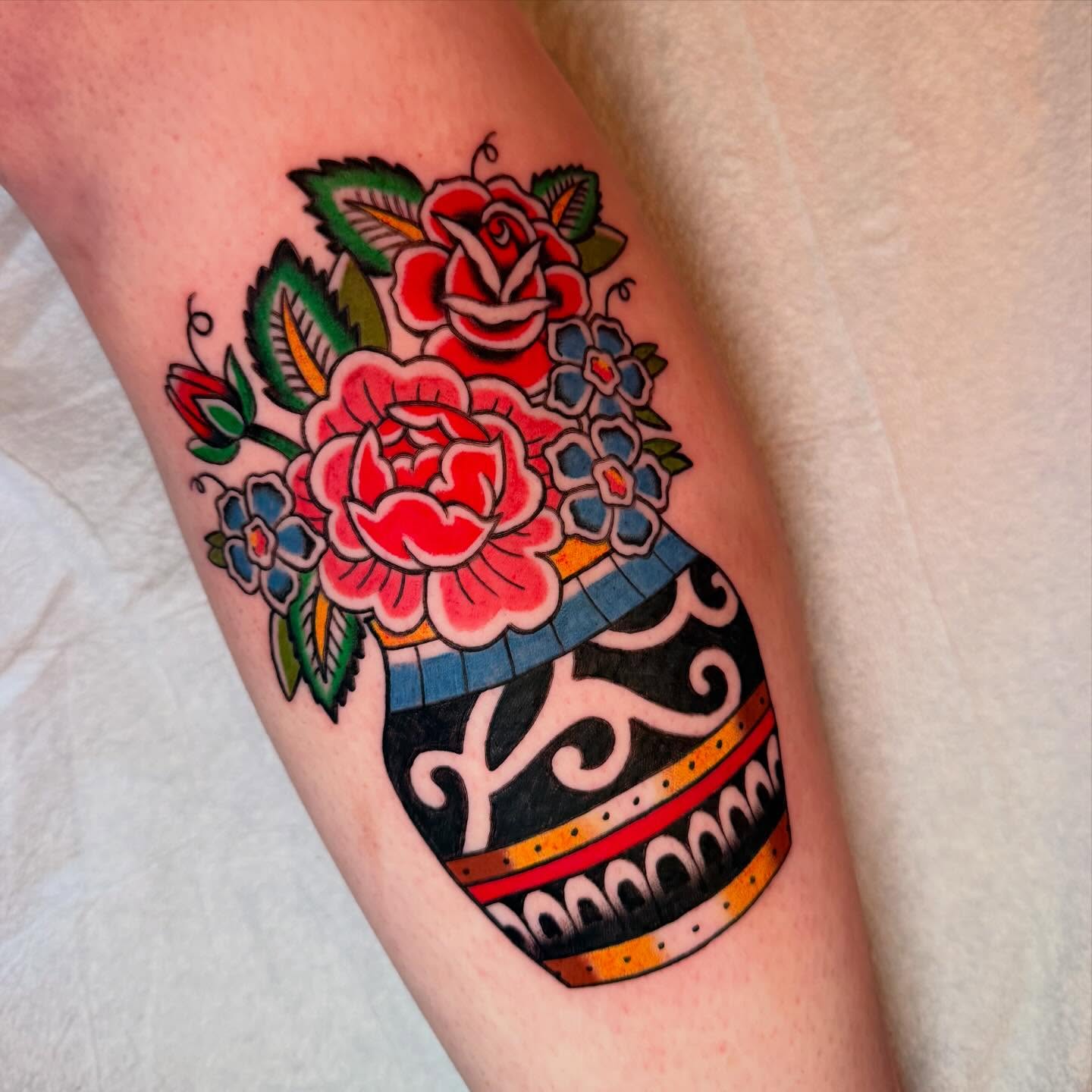 Flower bouquet American traditional tattoo on the forearm by charlie