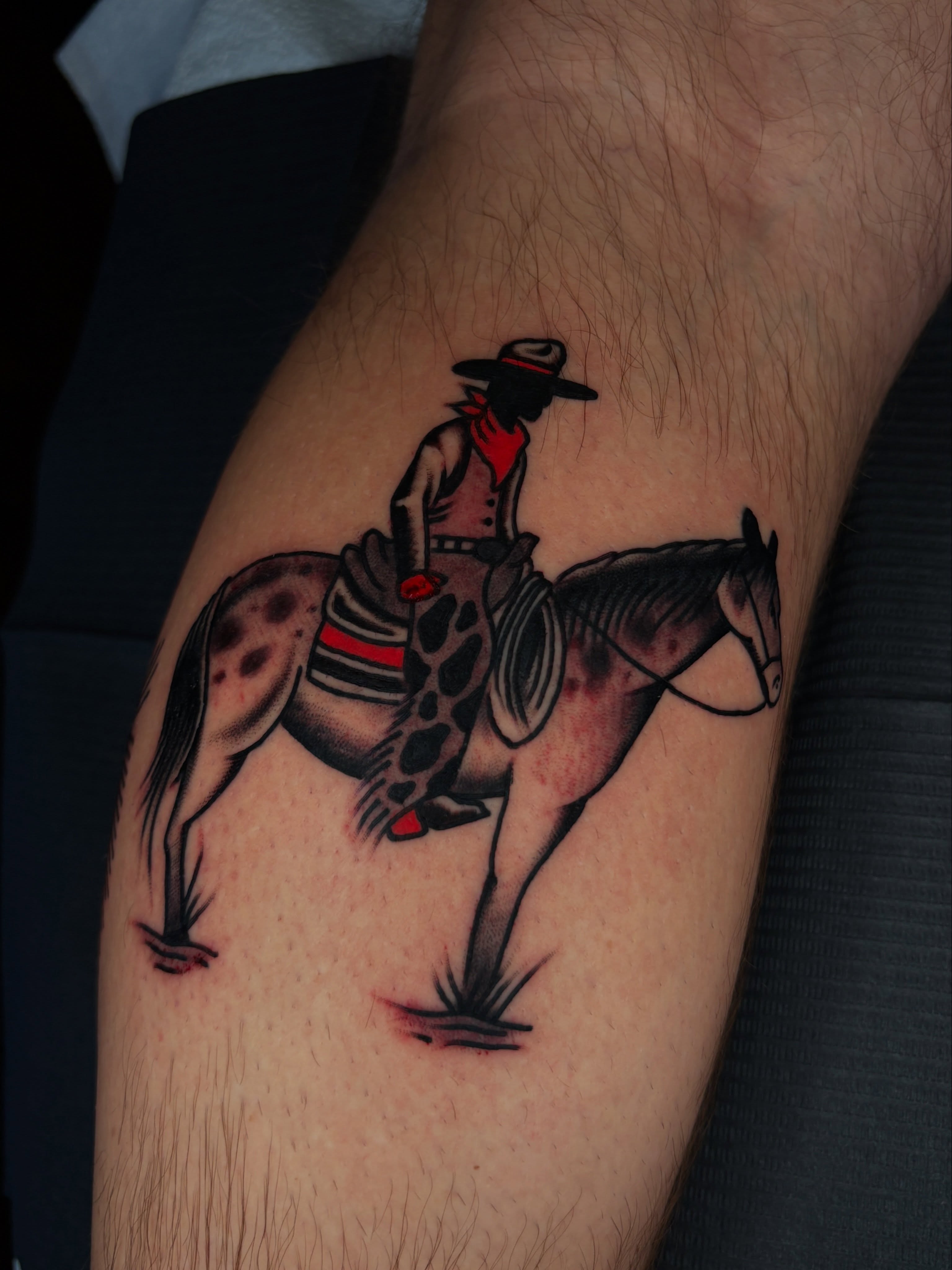Cowboy riding horse American traditional tattoo on the forearm by Max Klapp, Austin, Texas