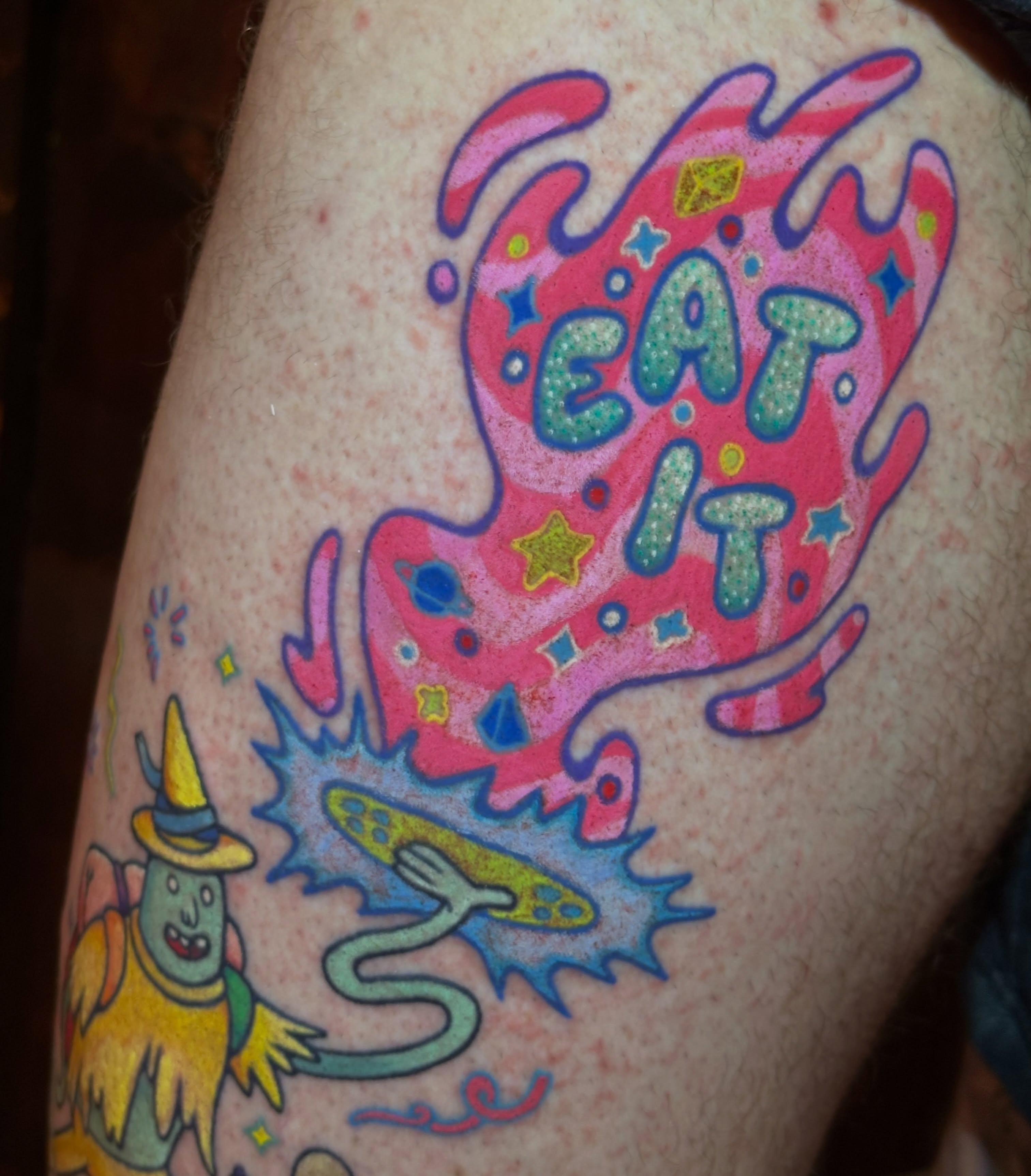 Eat it new school tattoo on the thigh by kira