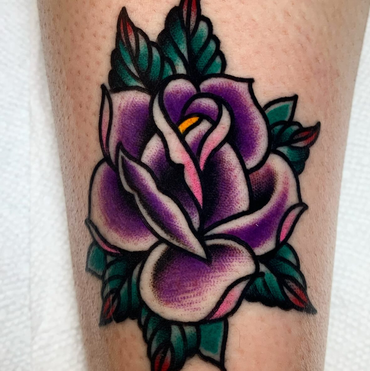 Purple rose American traditional tattoo on the forearm by Brandon Heredia, Vacaville, California